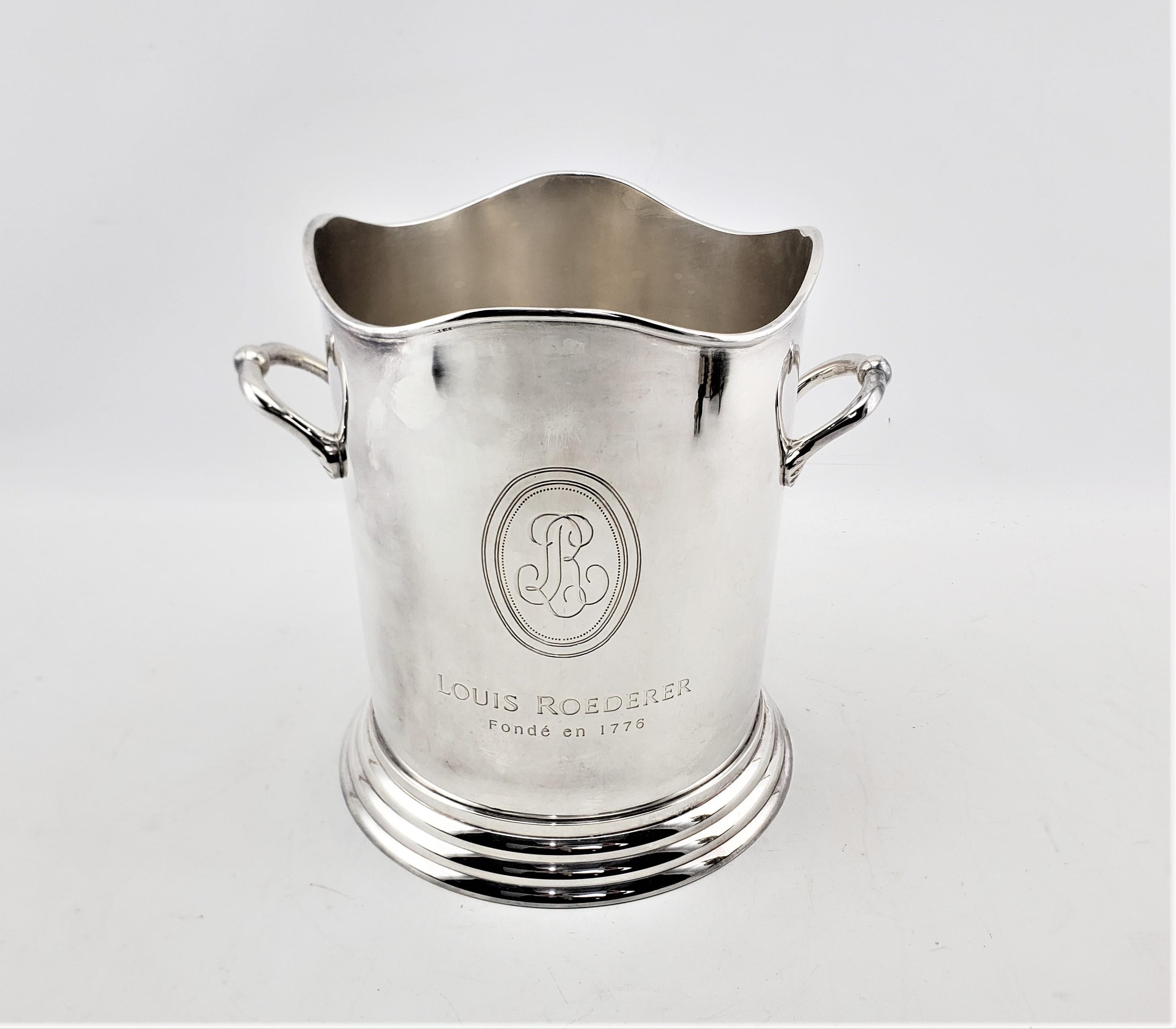 This silver or chrome plated champagne bucket is unsigned, but presumed to have originated from France and date to approximately 1960 and done in a Renaissance Revival style. The champagne bucket was made to advertise or commemorate the highly