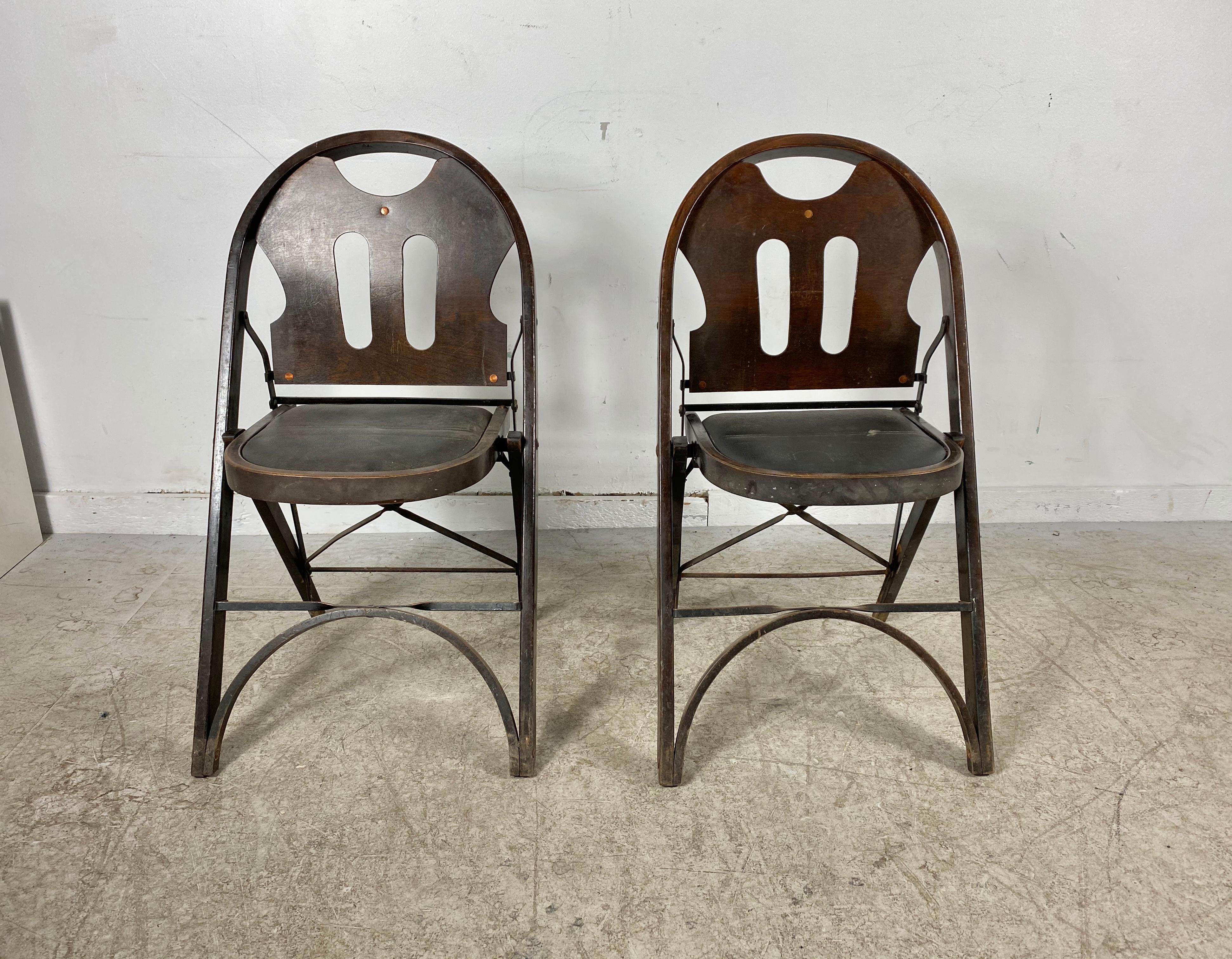 Louis Rostetter & Sons turn of the century industrial folding chairs, solid comfort, amazing design, part of the permanent collection of San Francisco Museum of Modern Art, retain original finish, patina as well as original labels.