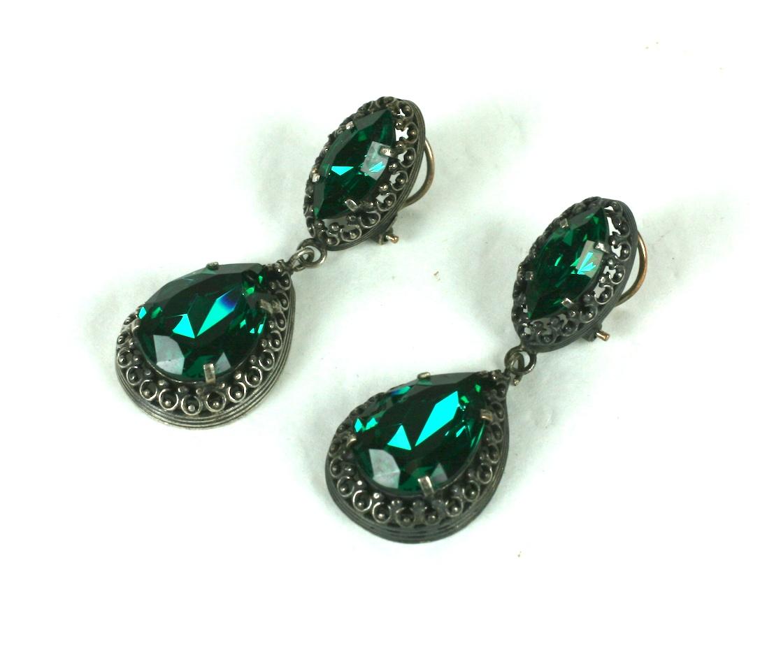 Louis Rousselet faux Emerald Georgian Revival ear clips. The faceted faux emerald marquise and pear shape glass stones are claw set in antique silver gilt metal.
Excellent Condition.
Length 2 1/2