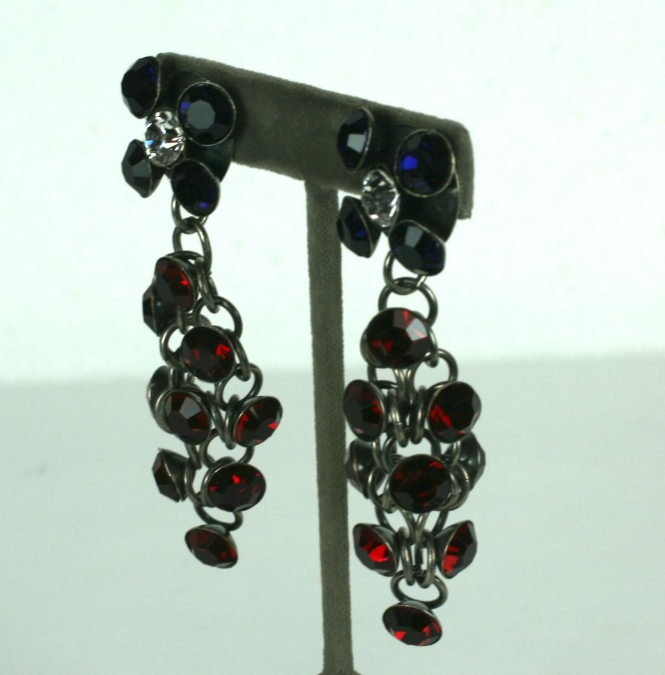 Louis Rousselet striking and unusual antique silver plate chain mail long ear clips, of faux deep sapphire, ruby, and crystal rhinestone pastes in cup settings. French wire clip fittings.
Excellent Condition, Signed Made in France.
Length 3 3/8