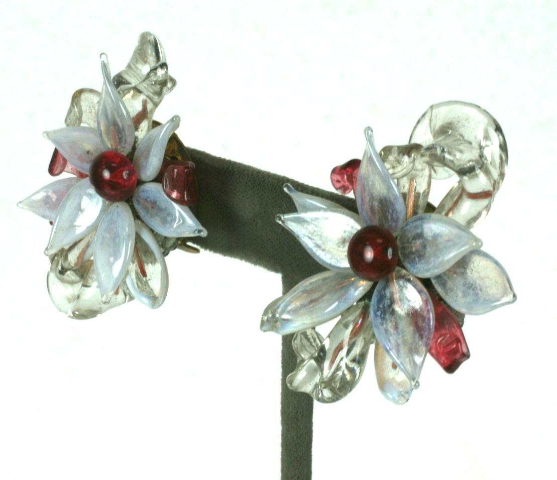 Beautiful Louis Rousselet large flower head earrings of signature hand made and hand wired opaline, crystal, and ruby button cabocheons, petals, leaves and stamens of handmade pate de verre glass. Gilt metal findings and clip back
