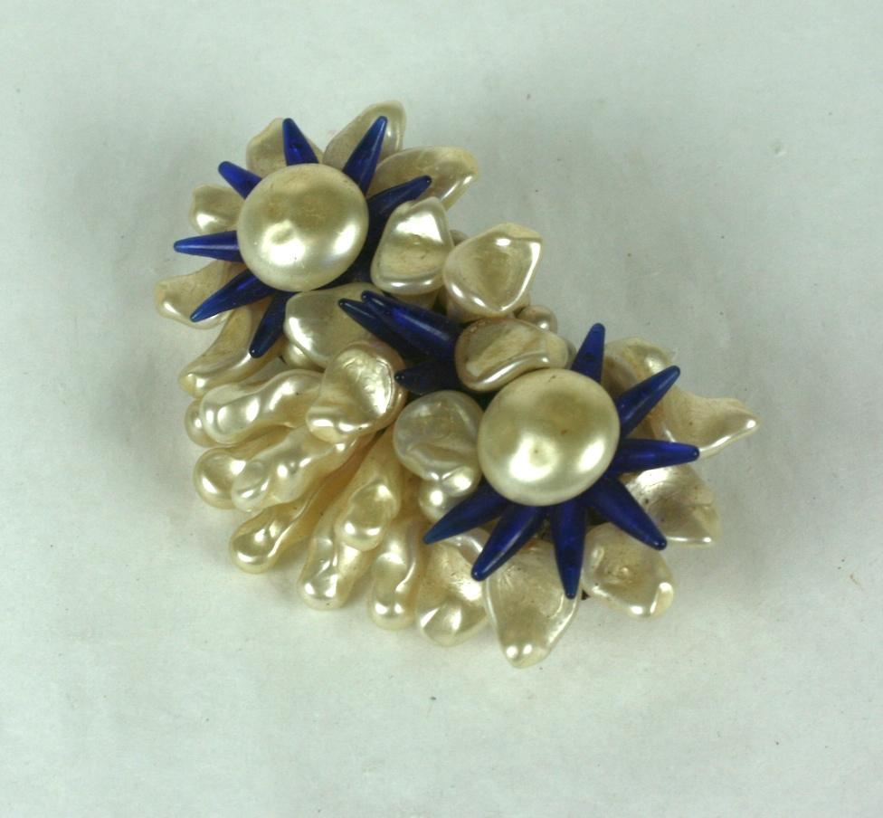 Louis Rousselet triple flower head brooch of signature hand made and hand wired nacre button cabochons, petals and leaves with deep sapphire stamens of pate de verre. Gilt metal findings and clasp. Handmade. 
Excellent Condition. Old Stock, Signed