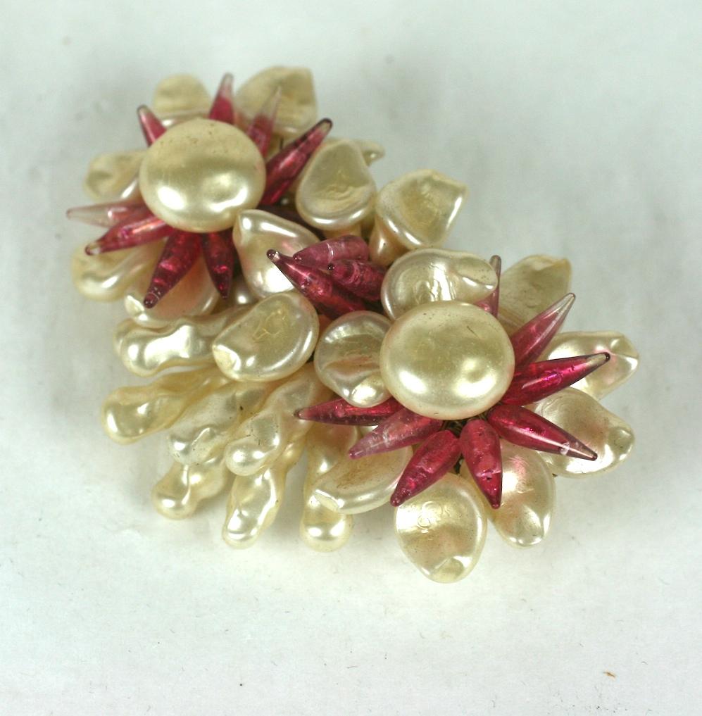 Louis Rousselet triple flower head brooch of signature hand made and hand wired nacre button cabochons, petals, leaves and and ruby stamens of pate de verre. Gilt metal findings and clasp. Handmade. 
Excellent Condition. Old Stock, Signed Made in