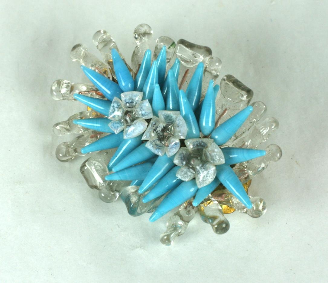 Louis Rousselet flower bouquet brooch of signature hand made and hand wired crystal petals, leaves and opaline flower heads with deep turquoise stamens, all of pate de verre. 
Gilt metal findings and clasp. Handmade.  Excellent Condition. 
Old