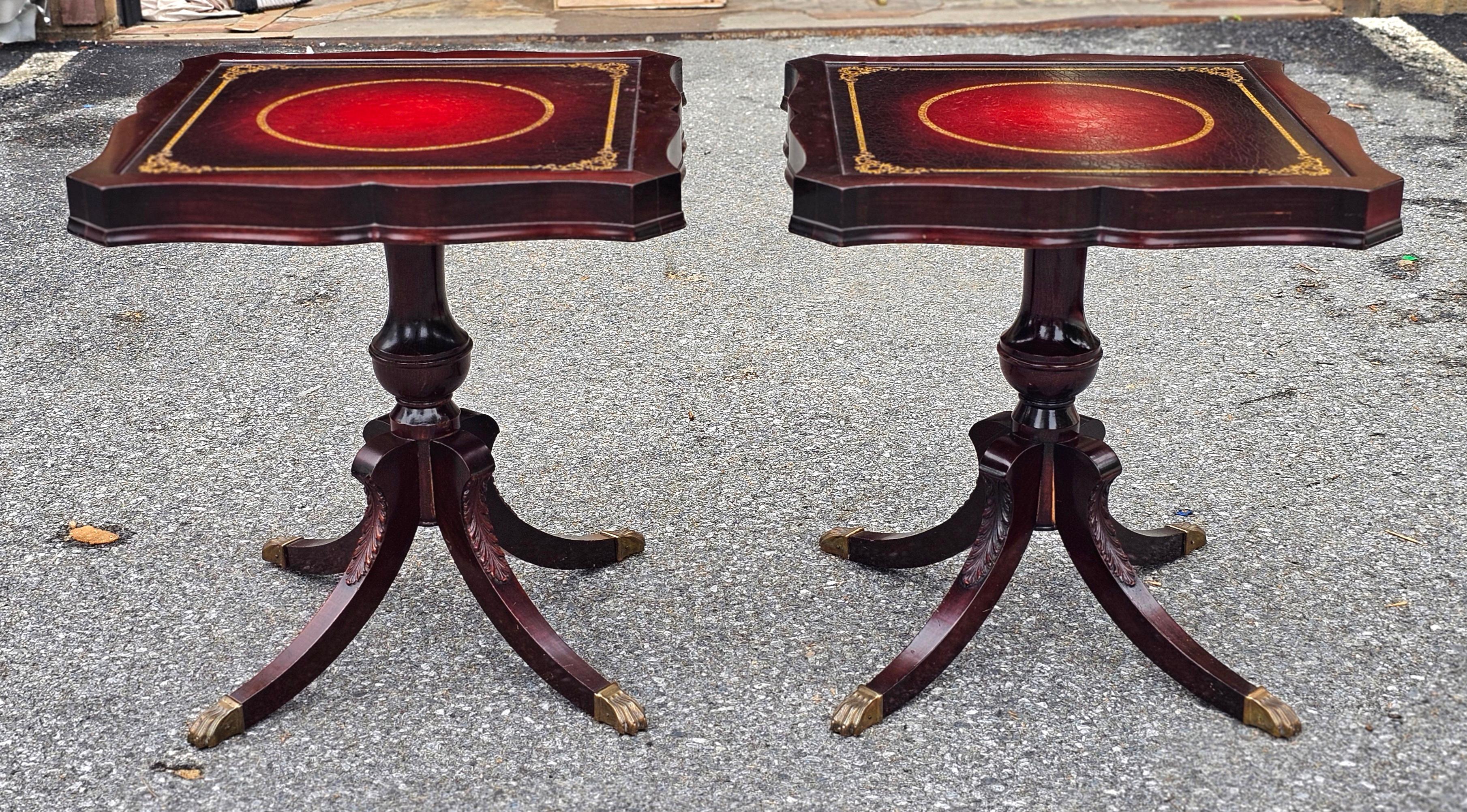 Louis Scalera English Regency Mahogany and Tooled Leather Pedestal Side Tables.
PAIR OF LOUIS SCALERA MAHOGANY AND TOOLED LEATHER TOP QUADPAD PEDESTAL SIDE TABLES These beautiful Carved Leather Top Side Tables are made out of Mahogany wood and Flame