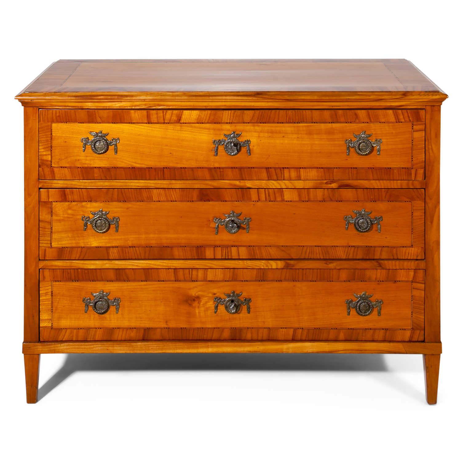 Louis seize chest of drawers, standing on tapered legs. The straight body has three drawers and each sides is framed with filet inlays.