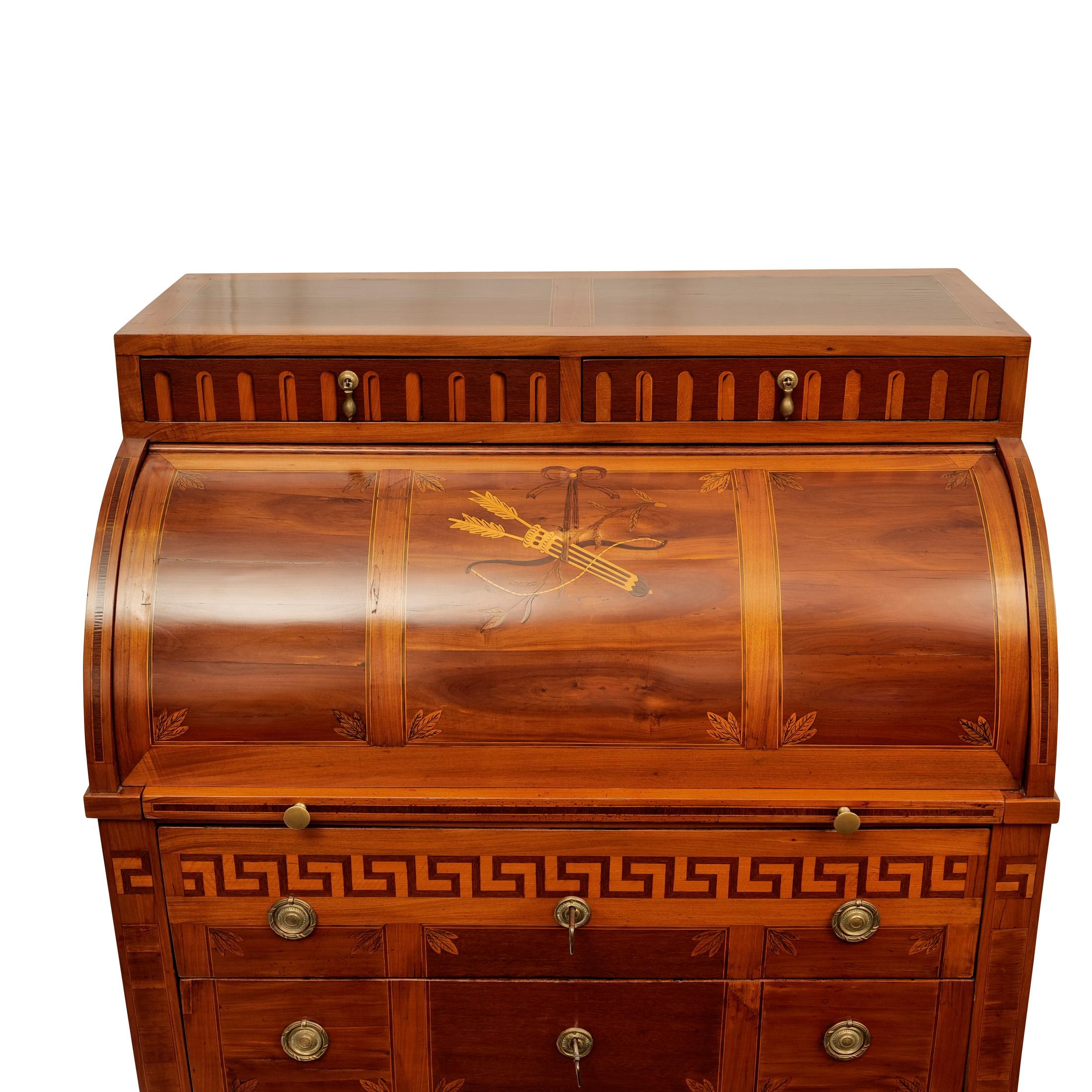 Cylinder bureau, Westphalia circa 1800, walnut and other fine woods veneered on oak, marquetry work, partly fire shaded, fluting and meander frieze, on the cylinder closure depiction of bow and quiver with arrows, 2-bay chest of drawers, cylinder