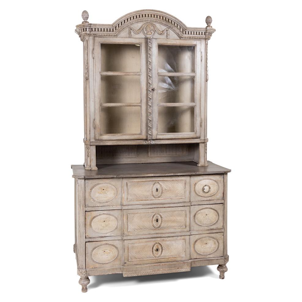Large Louis Seize top furniture with three-bowl dresser base and two-door cabinet top on balustraded and carved feet. Elaborately profiled and fluted surfaces are accented with rich carving. A garland-decorated medallion, one with crowning carved