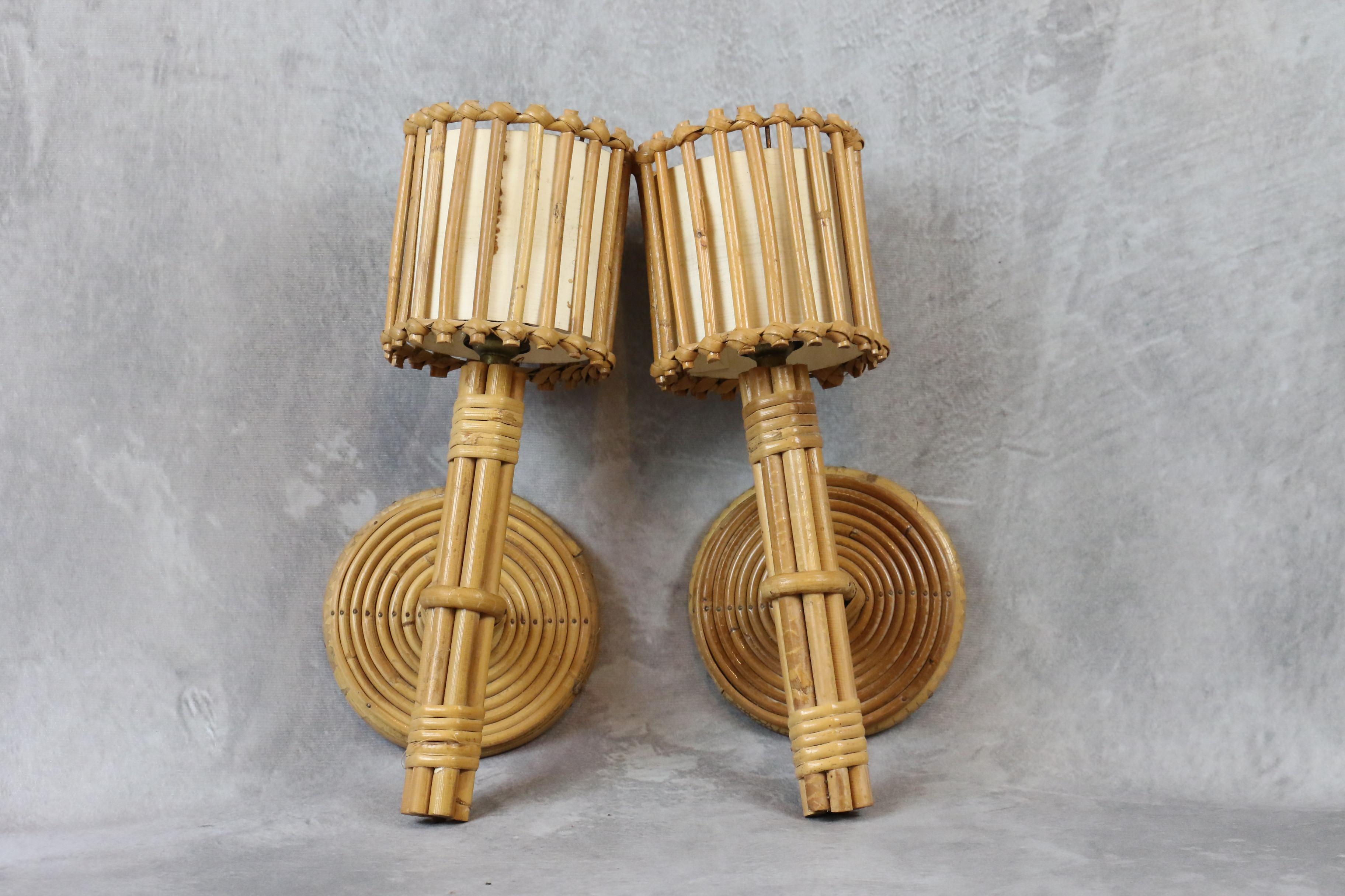 Louis Sognot bamboo and rattan pair of wall lamps Mid-Century Modern 1960 France

Beautiful pair of mid-century sconces by the French designer Louis Sognot. It is very well made. The artist has created many models using bamboo and rattan for the