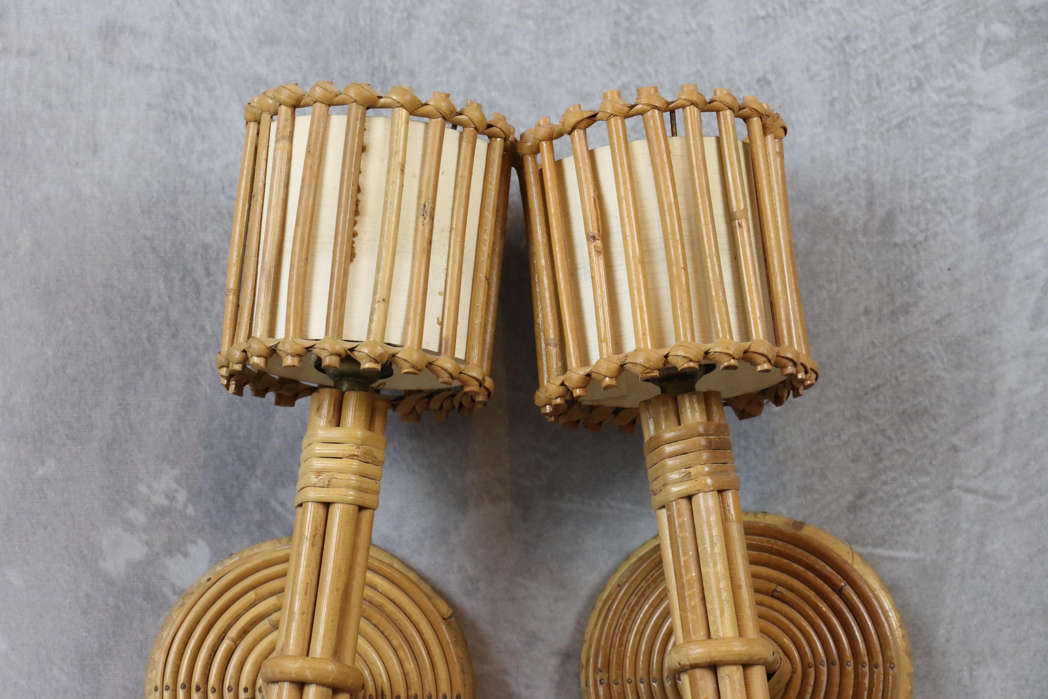 Hand-Crafted Louis Sognot bamboo and rattan pair of wall lamps Mid-Century Modern 1960 France For Sale