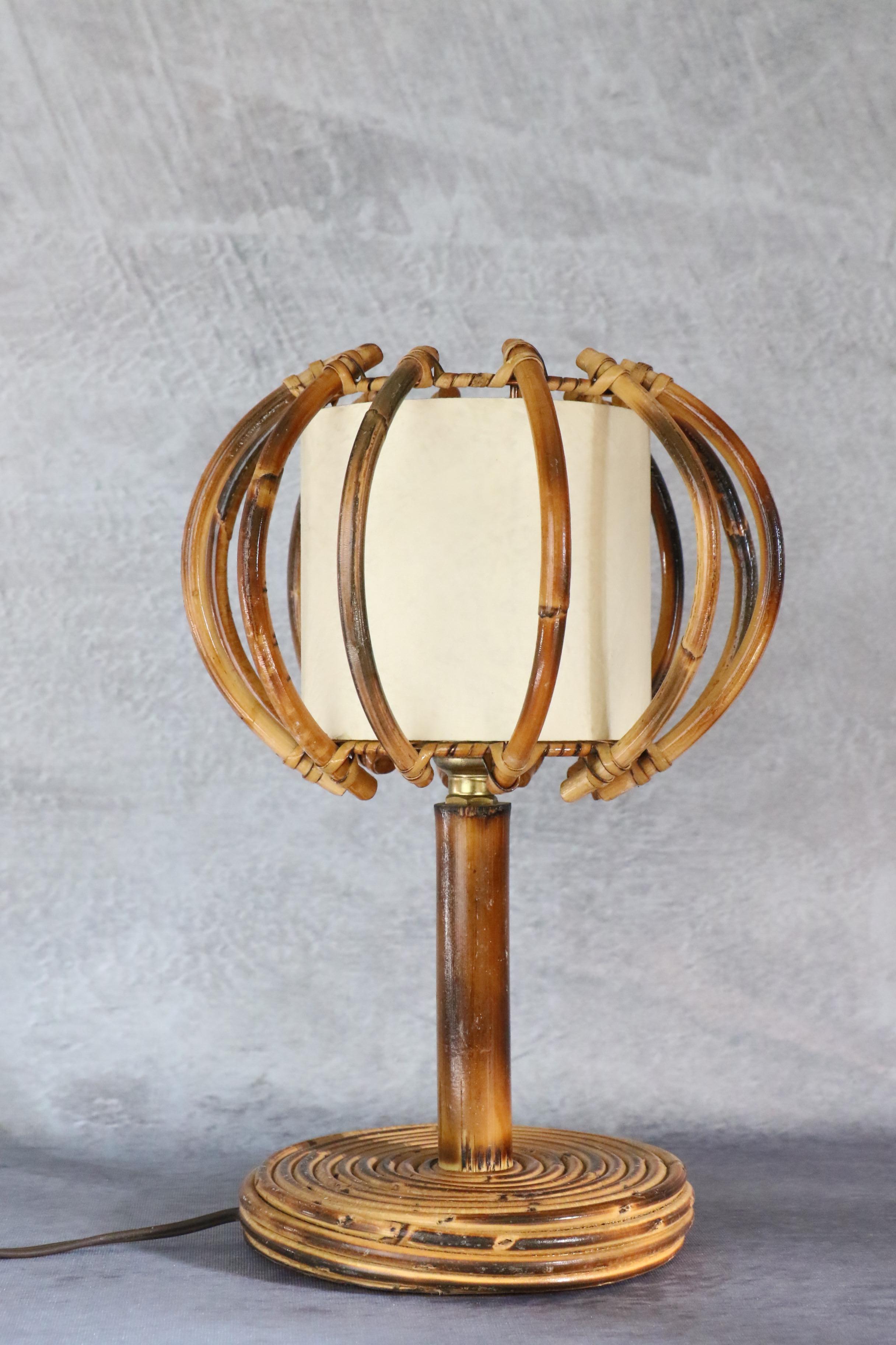 Louis Sognot bamboo and rattan table lamp Mid-Century Modern 1960, France

Very nice lamp by the French designer Louis Sognot. It is very well made. The artist has created many models using bamboo and rattan for the structure of his lamps, sconces