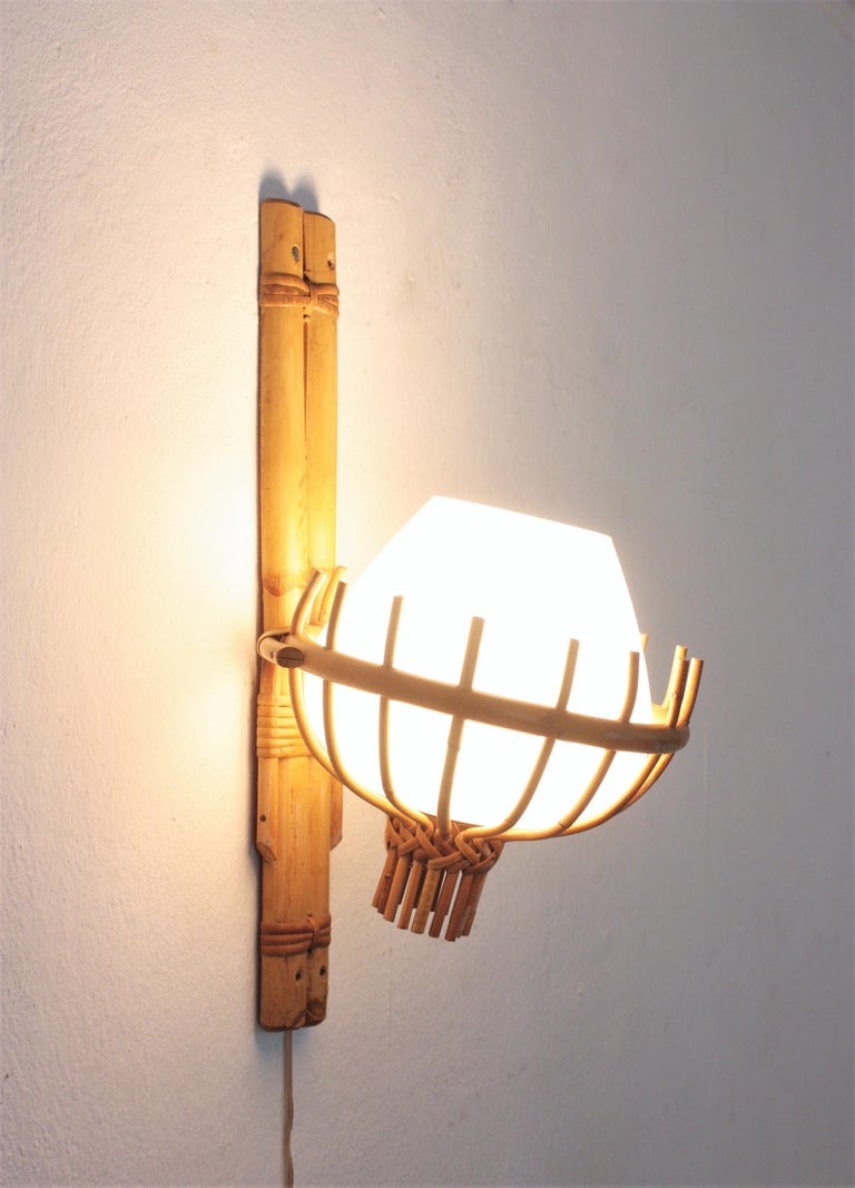 Hand-Crafted Louis Sognot Bamboo Rattan Wall Sconce with Milk Glass Globe Shade For Sale