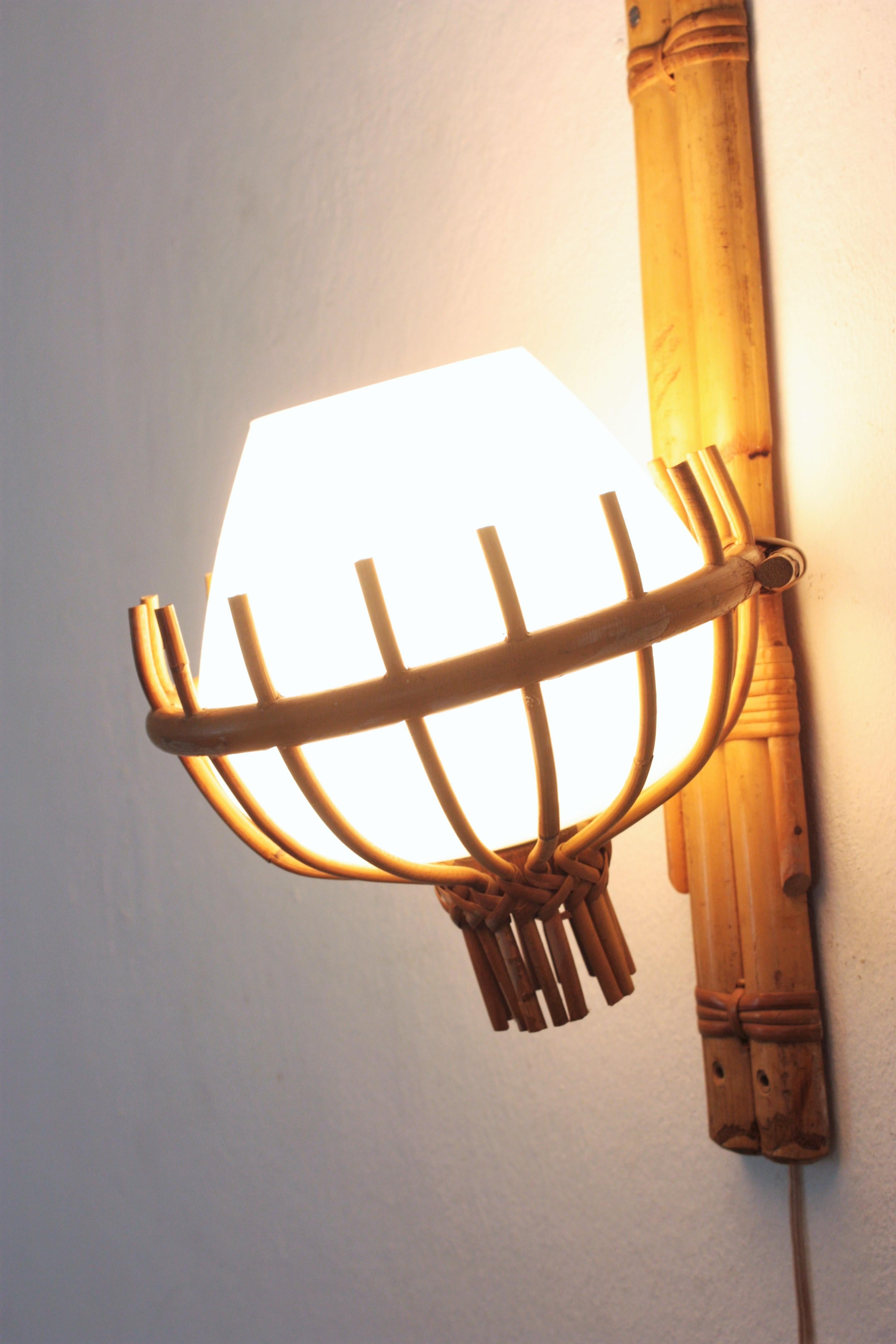 Louis Sognot Bamboo Rattan Wall Sconce with Milk Glass Globe Shade In Good Condition For Sale In Barcelona, ES