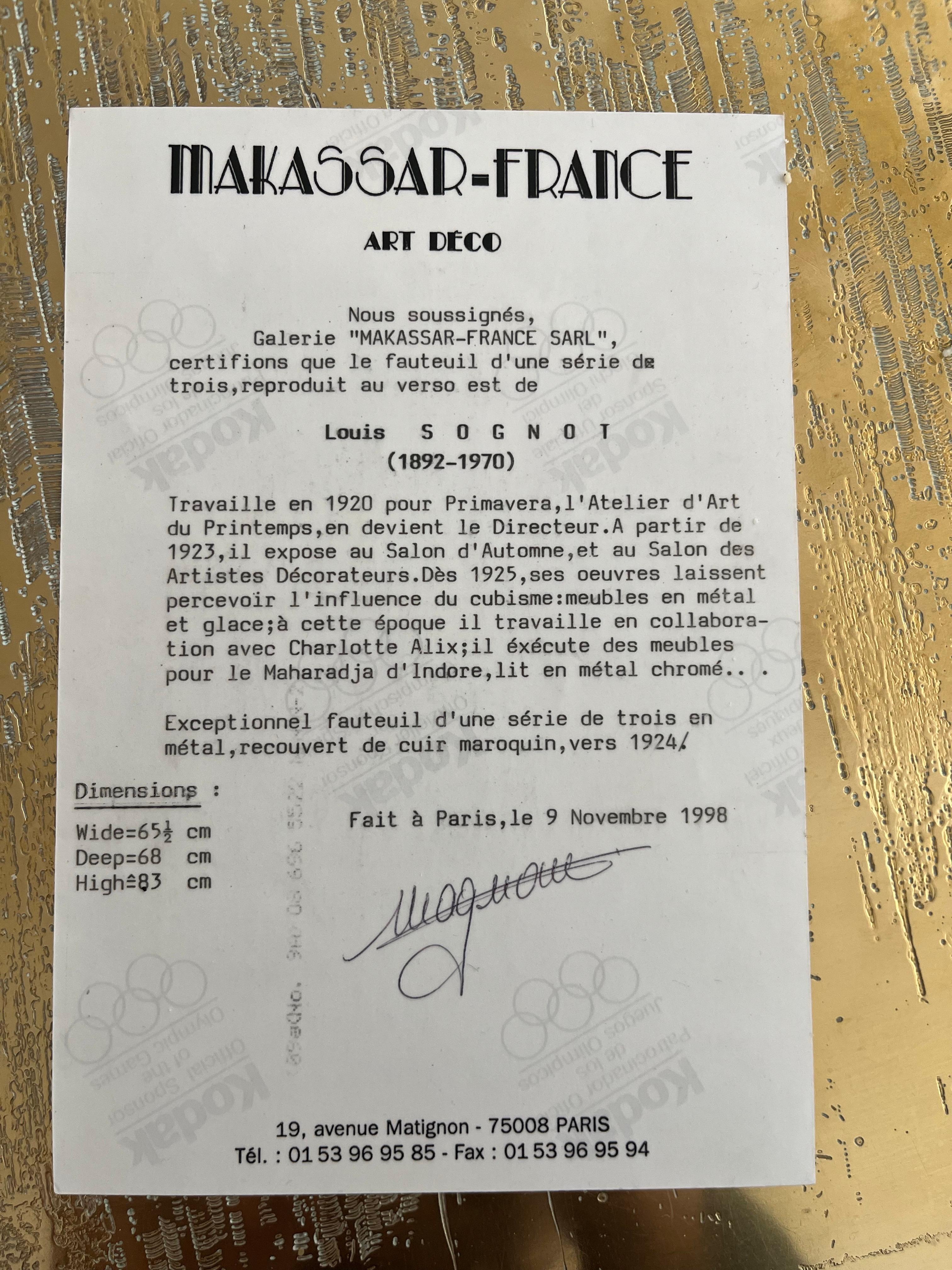 Incredible and rare pair of lounge chairs created by Louis Sognot and purchased at Makassar-France in 1998. Very heavy. Steel/Chrome with gold ball accents. Original paperwork attached.
The leather is perfectly weathered and in very good