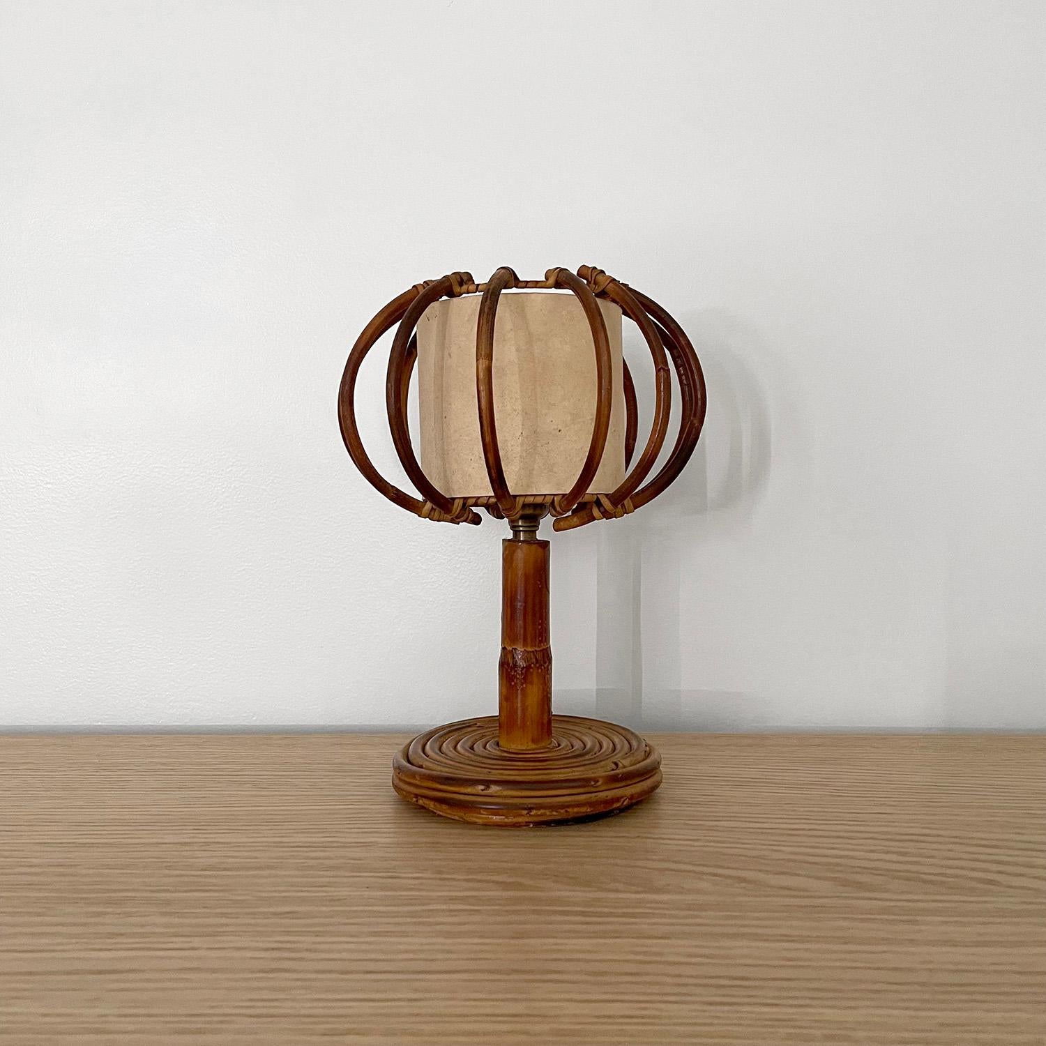 Louis Sognot French rattan lamp 
France, 1960s
Unique orb shade
Circular rattan base 
Patina from age and use
Newly rewired 
Single socket candelabra base 

We have a large selection of superb vintage lighting 
Please see other listings 