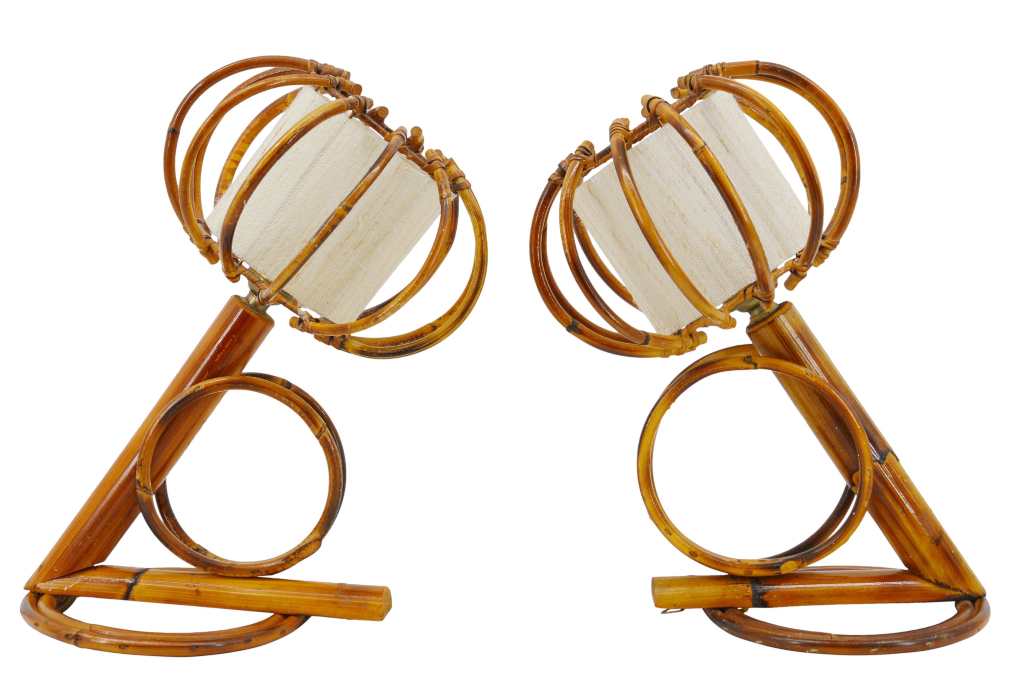 Pair of bamboo wall sconces by Louis Sognot, France, 1950s. Bamboo, rattan and fabric. Original fabric shades. A wonderful example of mid-century craftsmanship, where bamboo and rattan are perfectly blended. Measures: Height: 9.8