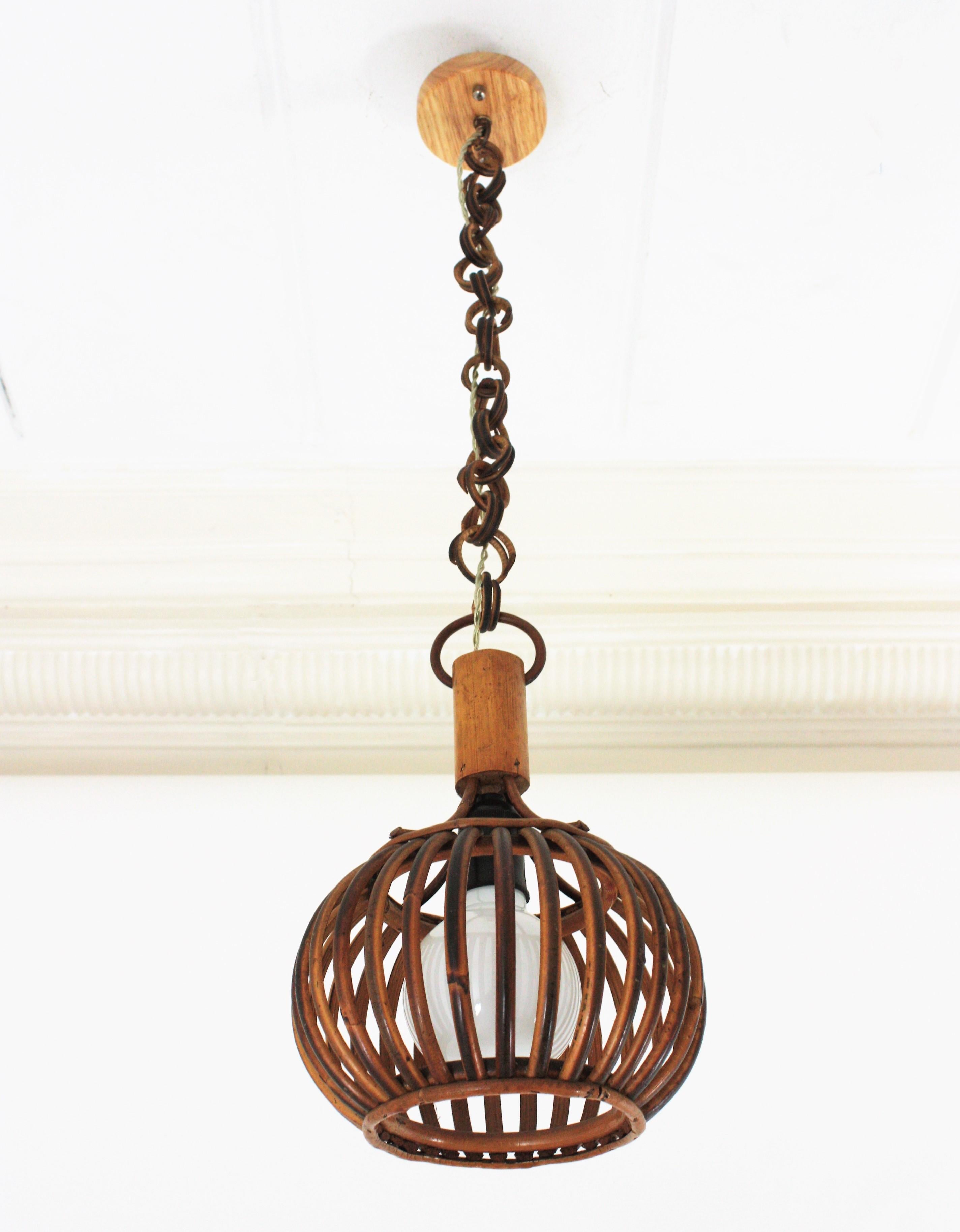 Eye-catching Louis Sognot attributed rattan ceiling pendant hanging light, France, 1950s
This lantern has an beautiful design featuring a semi-spherical rattan structure made of rattan curved canes topped by a wooden cylinder to hang the lampshade