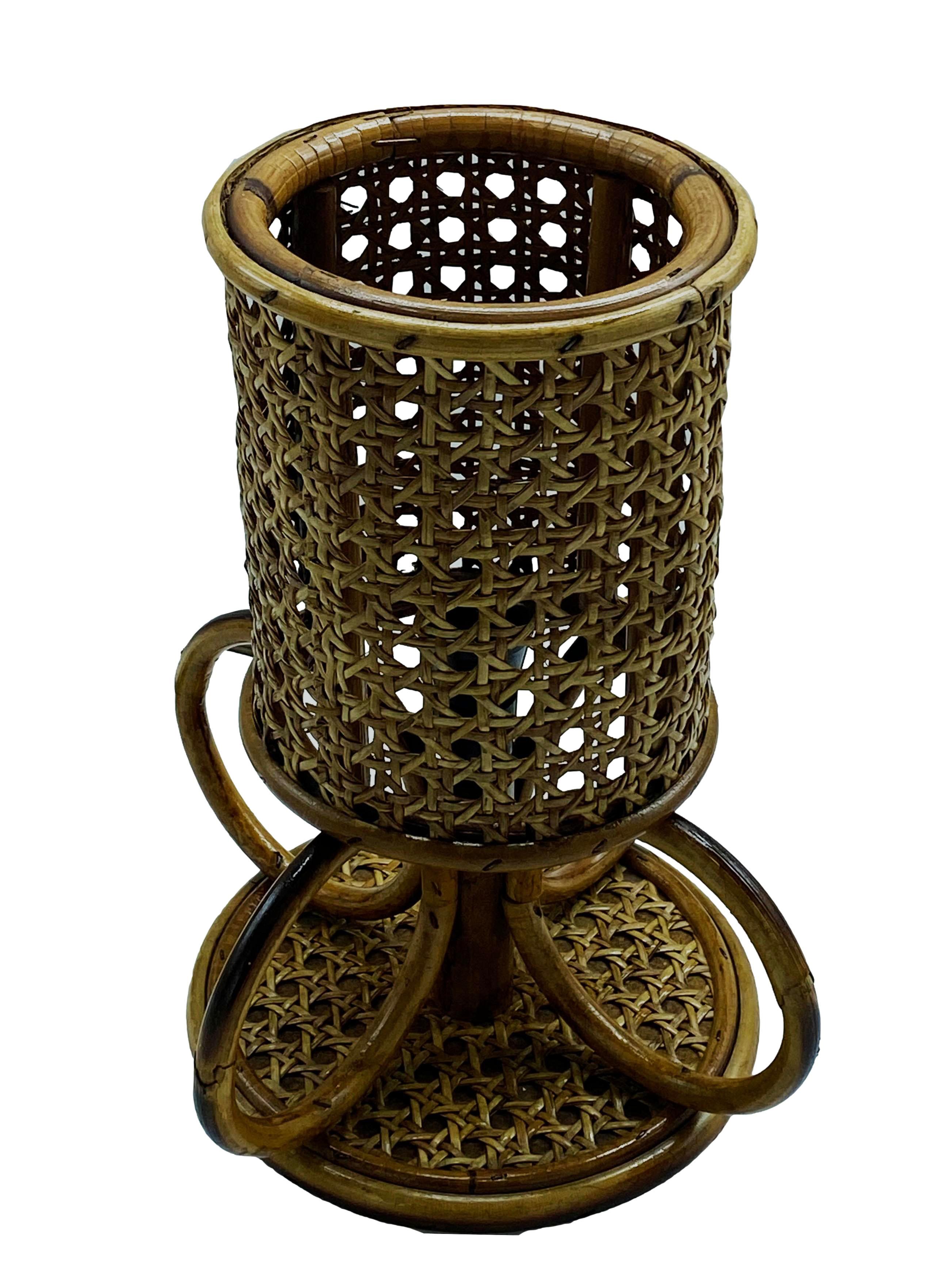 Delightful little table or bedside lamp made from bamboo and rattan. The shade is made of Viennese mesh, while the base shows a rattan and bamboo construction.
 