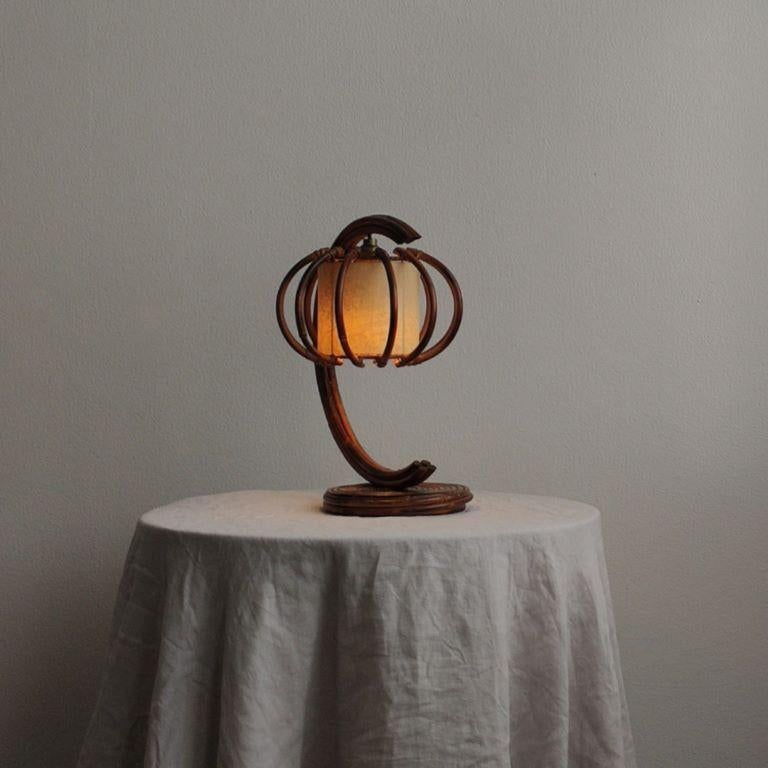 Louis Sognot table lamp
France, circa 1950’s
Sculptural rattan arm with torchiere
Original parchment shade
Comes with US adapter & light bulb

Measurements :
12