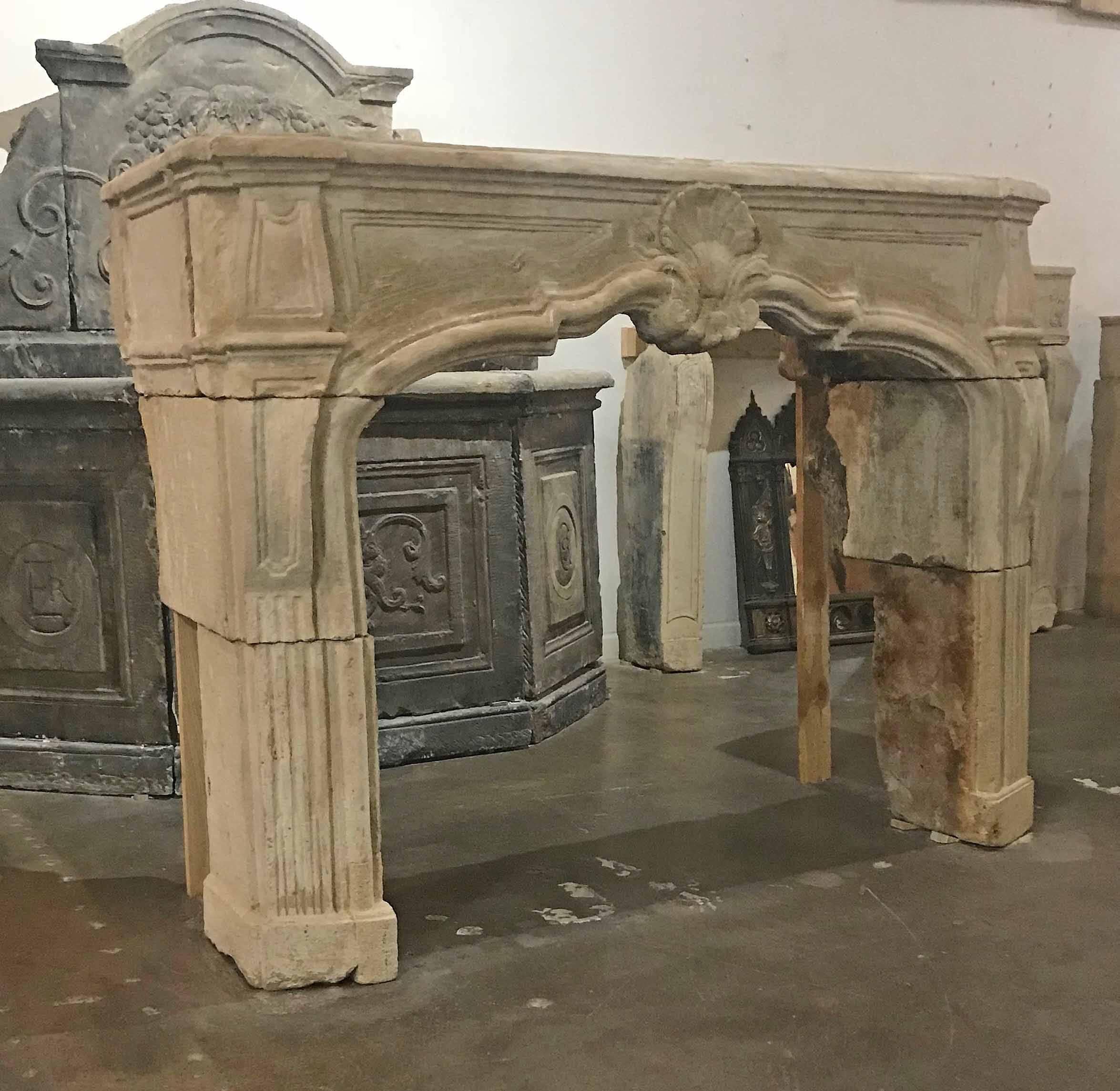This beautiful limestone mantel once reclaimed from a French Chateau, can now become the centerpiece of your home. Its beautiful lines boast a shell and fluting along the base of the legs.

Measurements: 64
