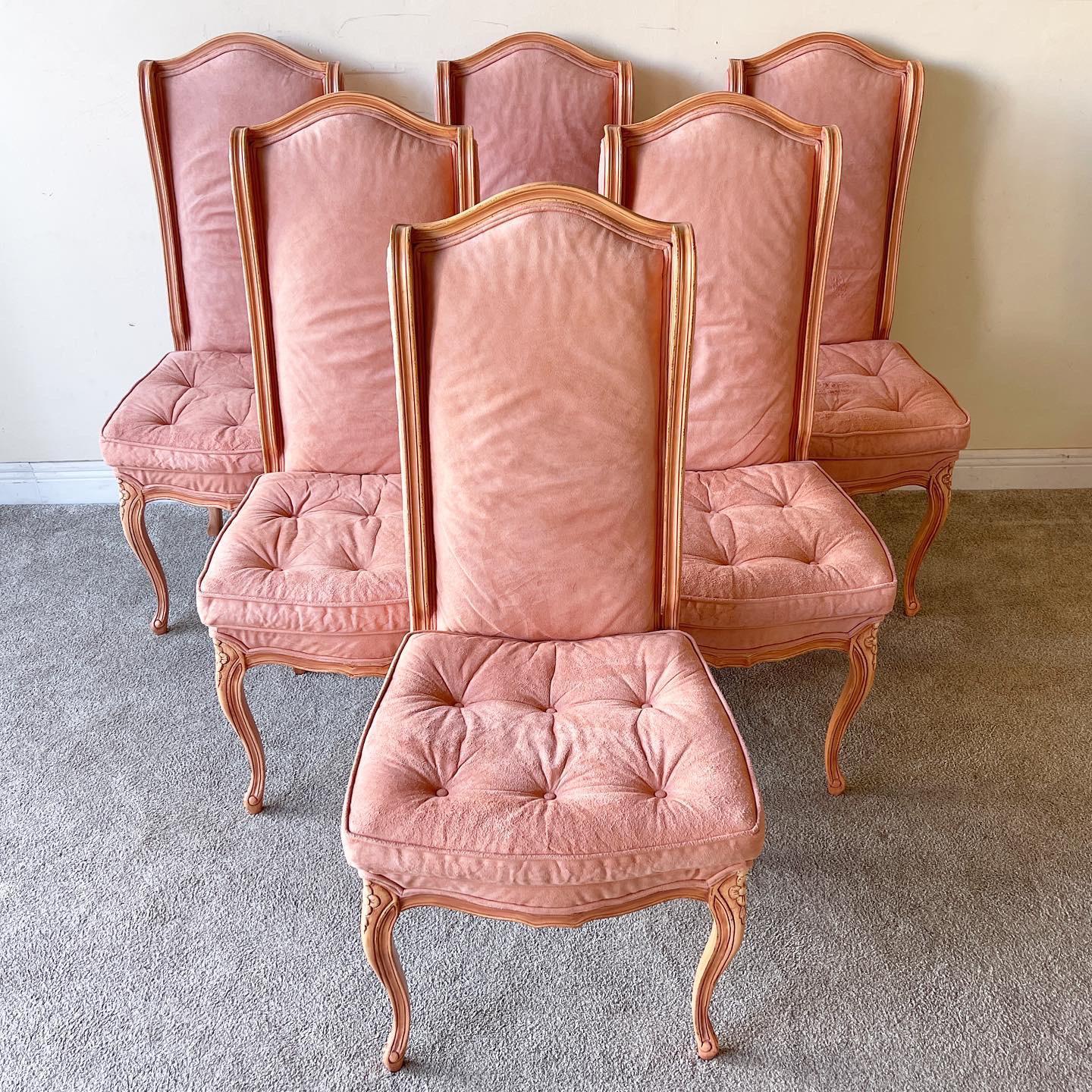 Incredible set of 6 Louis the Xv style dining chairs. Exceptional wooden frame has been finished with a pink varnish. Fabric is a peach/pink velvet.