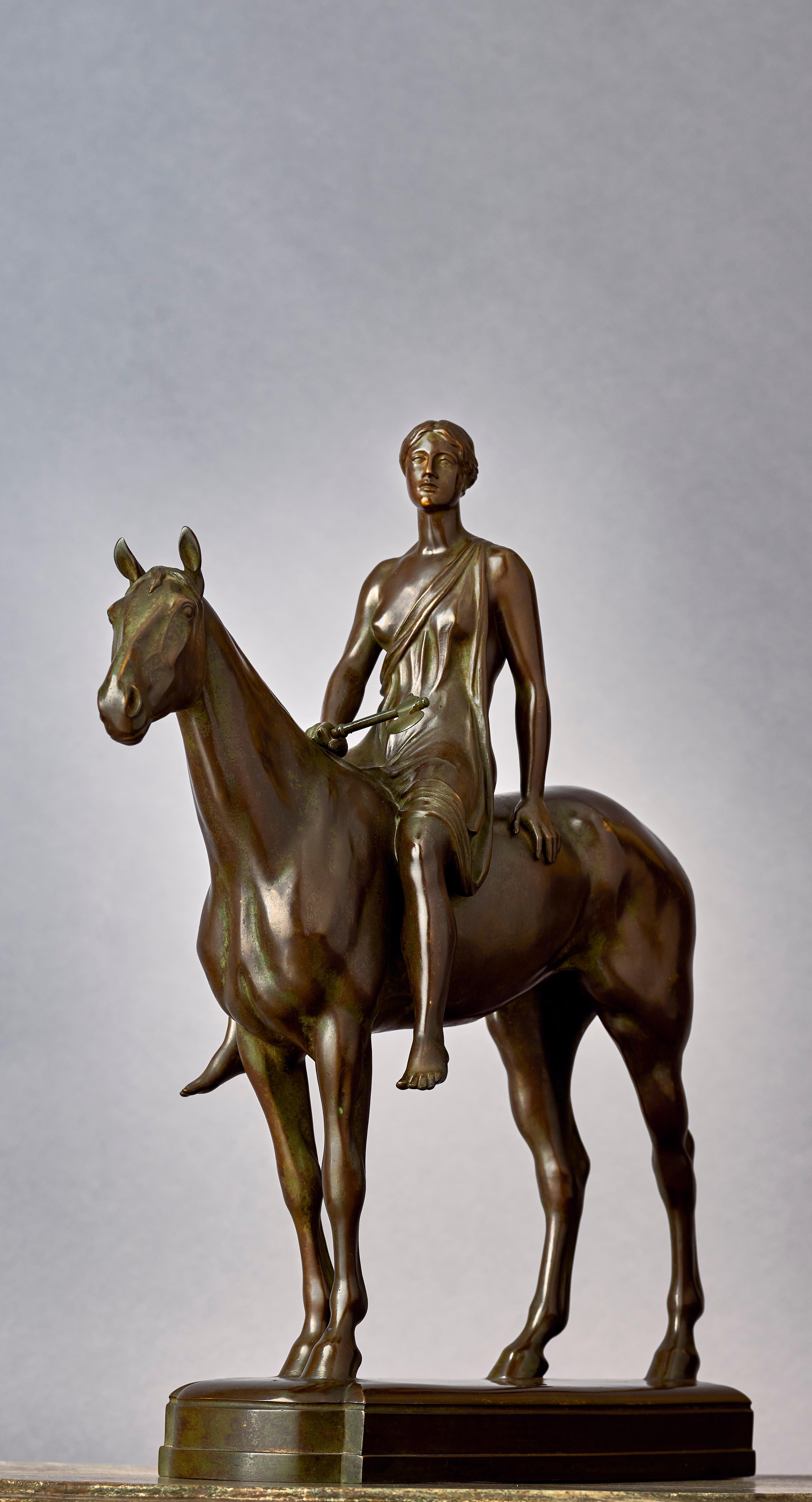 Louis Tuaillon (1862-1919) was a Prussian sculptor during the Belle Époque and this is a reduced bronze of his most famous work 'Amazone zu Pferde' (Amazone on horseback), which Tuaillon created between 1890 and 1895 in Rome and that which he showed