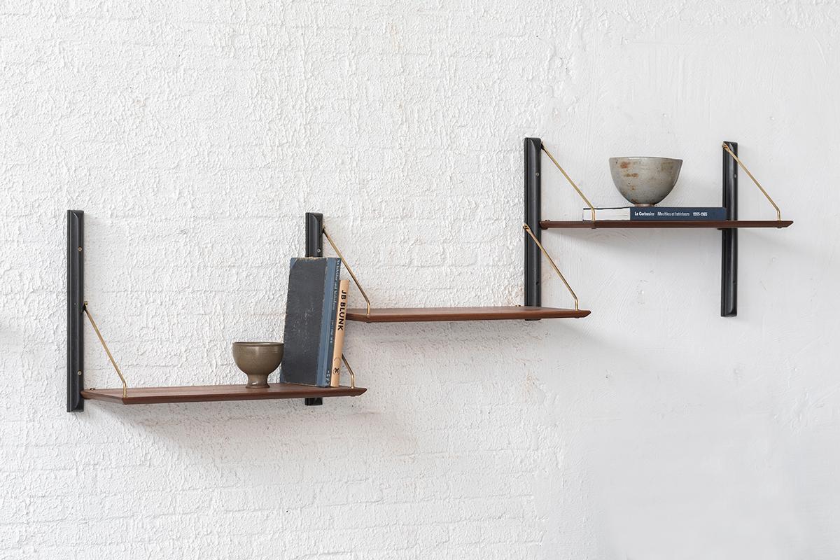3-Piece modular shelving unit, designed by Louis Van Teeffelen and produced by Wébé in the Netherlands around 1960. This set features 4 floating, black Limba wooden supports that hold 3 deep shelves of 32 cm. In good condition as shown in the