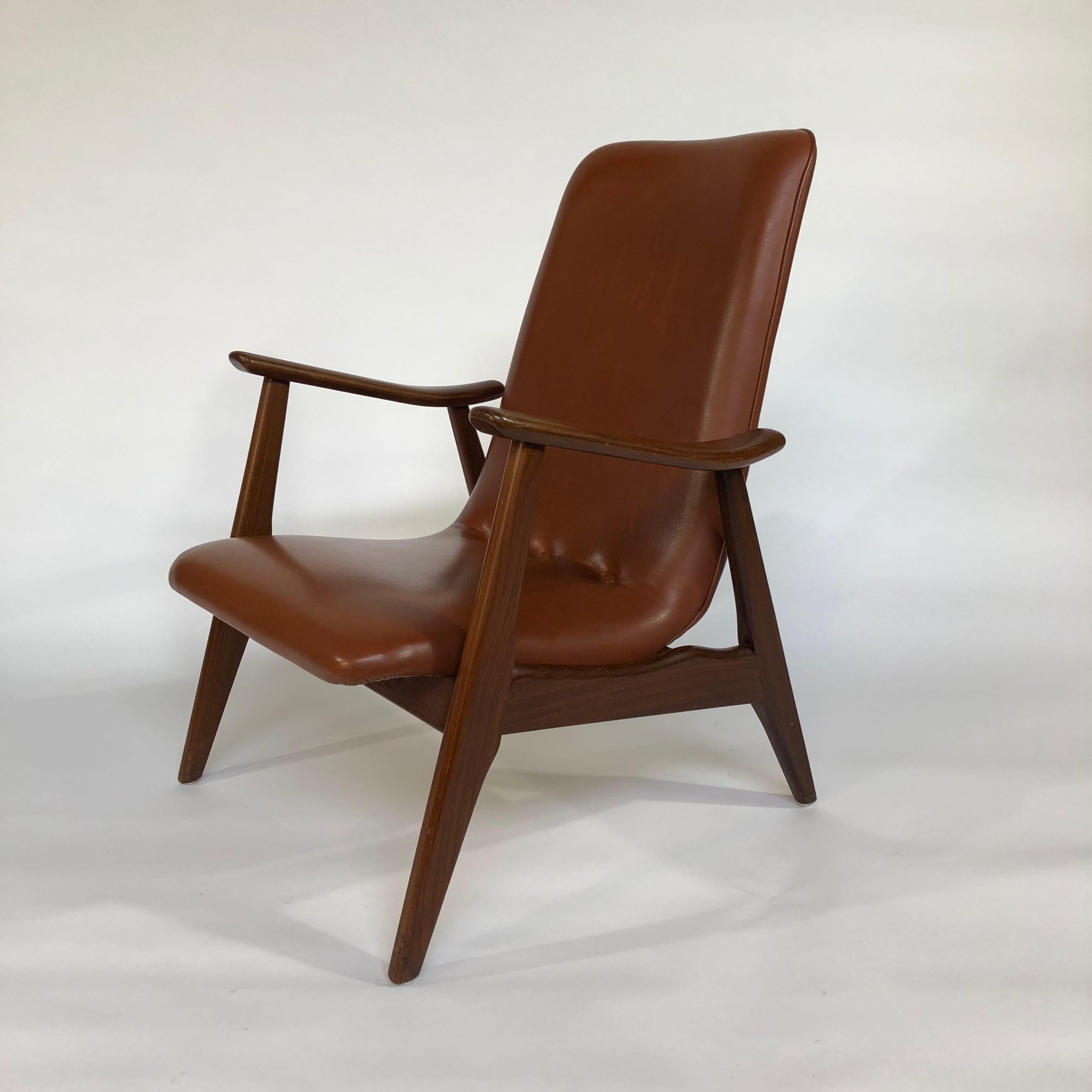 Dutch design lounge chair by Webe by Louis Van Teeffelen, 1960s. The chair is made of solid Teak and has the original cognac colored faux leather upholstery
This chair, with the high back is a mans version we also have the woman's version in the