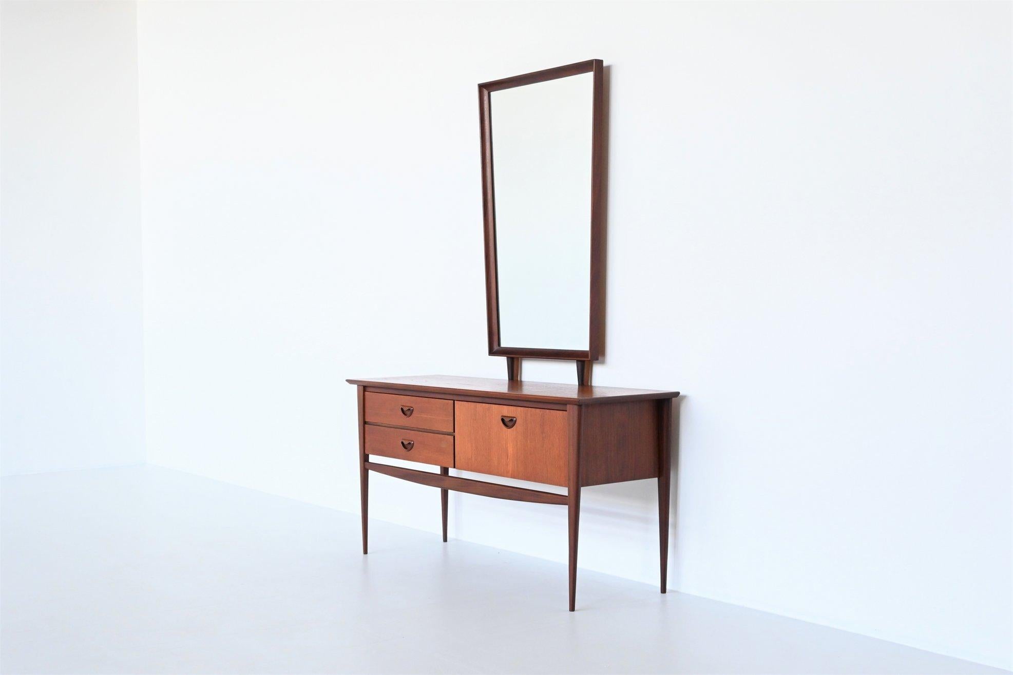 Beautiful shaped dressing table or sideboard designed by Louis van Teeffelen and manufactured by Webe Meubelen, The Netherlands 1960. It is made of solid and veneered teak wood. This high quality cabinet has very nice details like the well-crafted