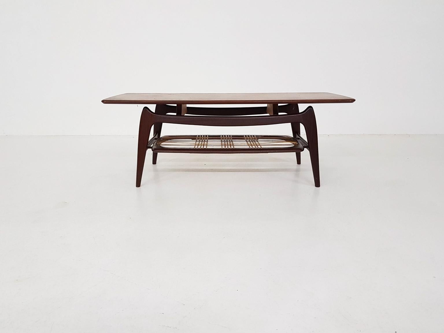 Teak coffee table with rattan magazine rack. Model Nr. 16.

Some rattan strings have been renewed.

These table is made by Wébé the Netherlands. Wébé was a Dutch furniture producer with Louis van Teeffelen as their most famous designer. Van