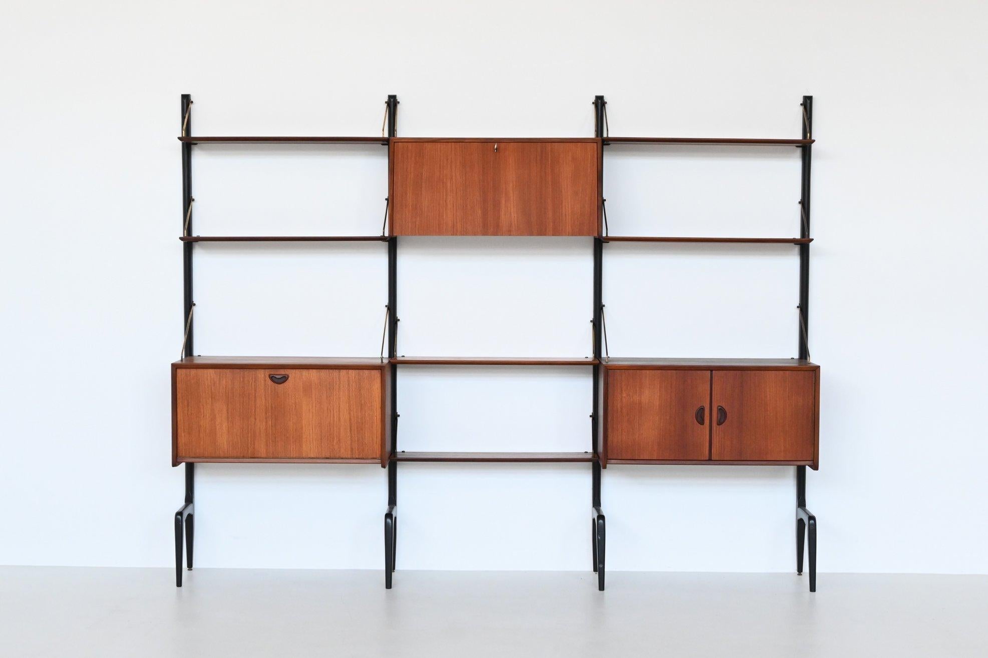 Beautiful large freestanding wall unit designed by Louis van Teeffelen for Webe, The Netherlands 1960. This highly versatile and functional wall system offers a variety of storage and display options. It is made of veneered teak wood in combination