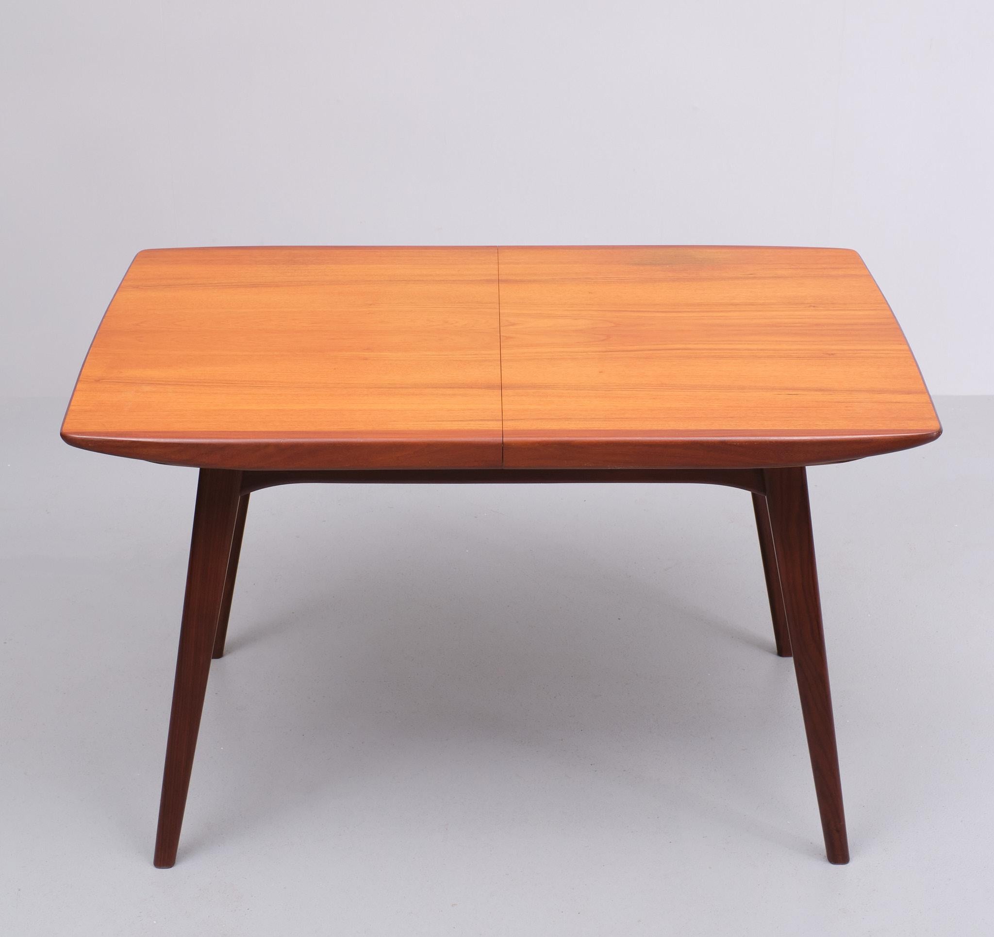 Beautiful Teak extendable dining table ,Very good quality table .comes with 
a folding out extension. Nice organic shape .   Design by Louis van Teeffelen 
for Wébé  Holland 1960s . One stain on the table .see photos .
Height 74 cm Width 120 cm to