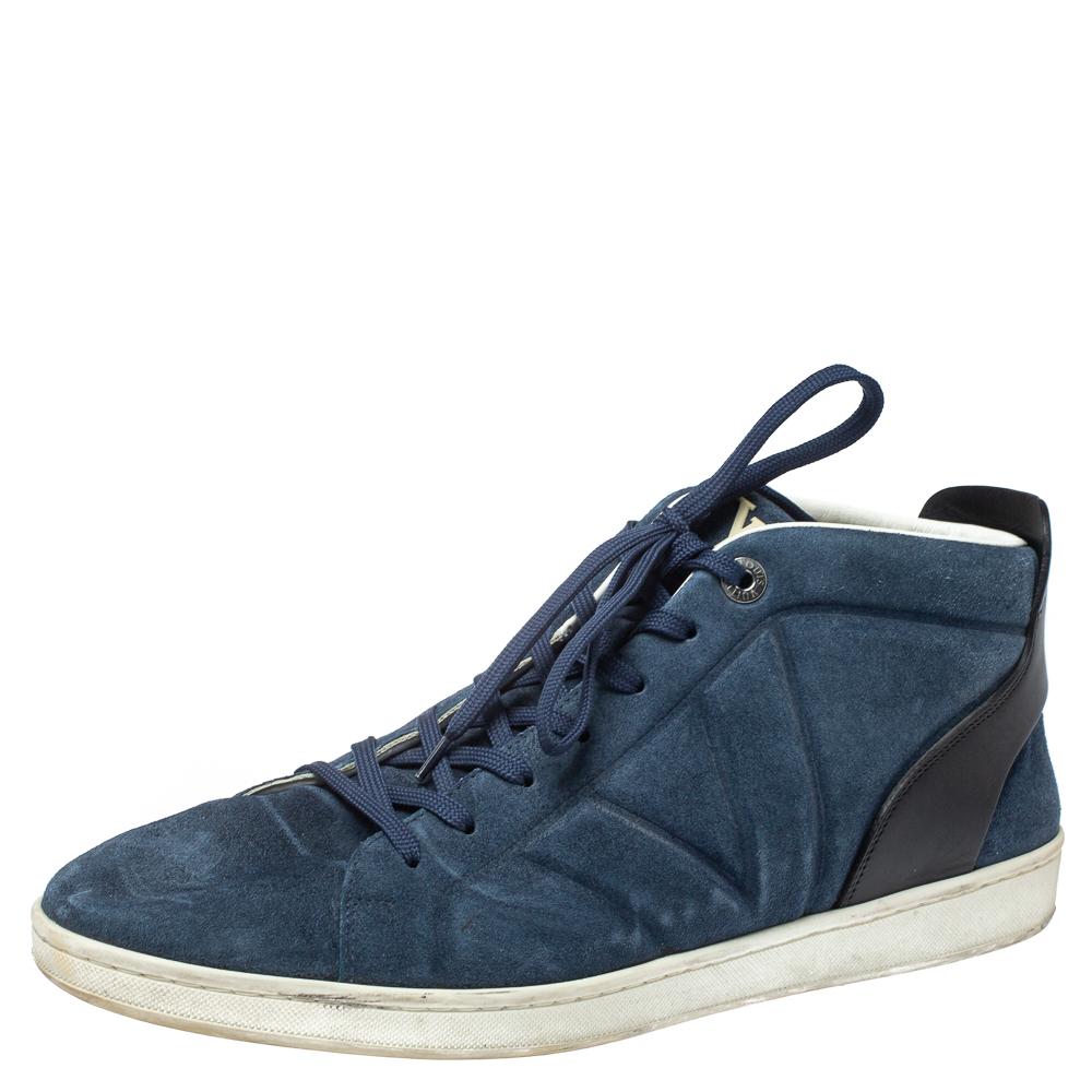Pull off a dapper casual look in this pair of sneakers from Louis Vuitton. The sneakers have been crafted from black & blue-hued suede & leather and styled with a high top, a lace-up vamp, round toe, and the brand's logo on the heels. This pair