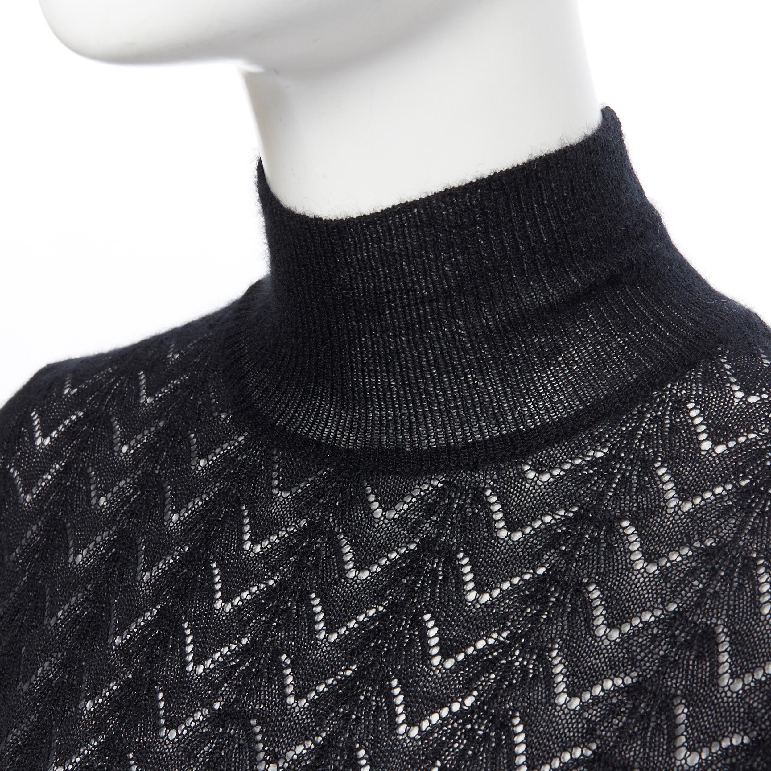 LOUIS VUITTON 100% cashmere black lace loose knit  turtleneck sweater top M
Brand: Louis Vuitton
Model Name / Style: Cashmere turtleneck
Material: Cashmere
Color: Black
Pattern: Geometric
Extra Detail: Long sleeve. Turtleneck neckline.
Made in: