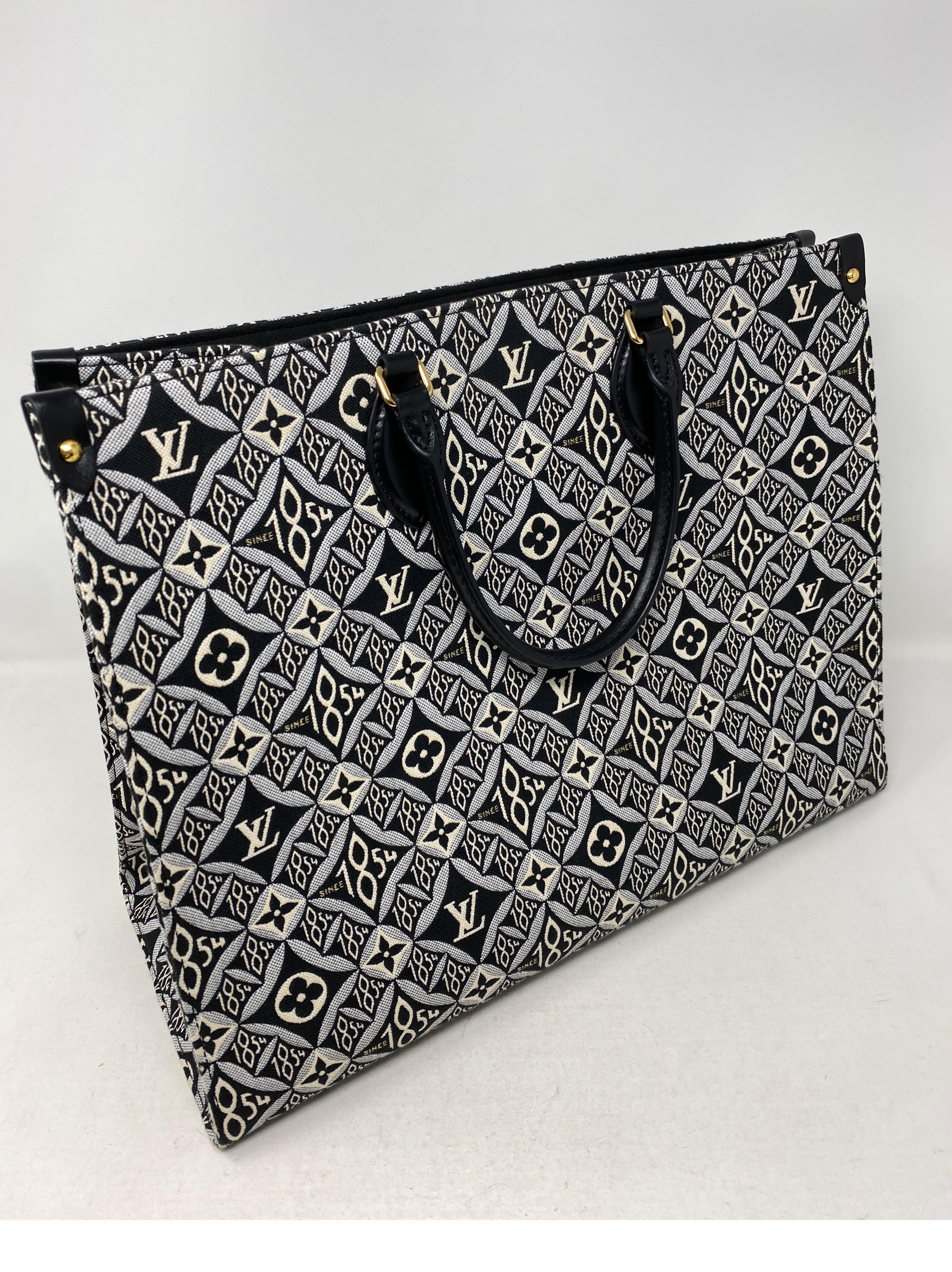 Louis Vuitton 1854 On The Go Bag. Beautiful embroidered black and white detailed big tote. Mint like new condition. Two types of handles to be worn different ways. Rare and limited. Guaranteed authentic. 