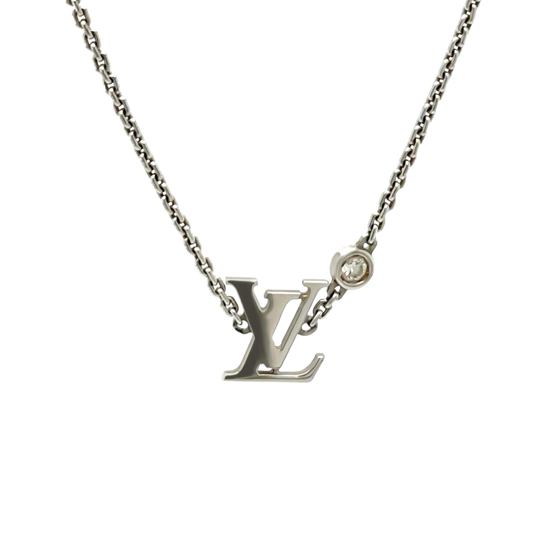 This exquisite Louis Vuitton Idylle Blossom LV Pendant Necklace is crafted in 18ct white gold, weighing 4.36 grams. The pendant features the iconic LV monogram, beautifully accented with a delicate brilliant-cut diamond, blending modern elegance