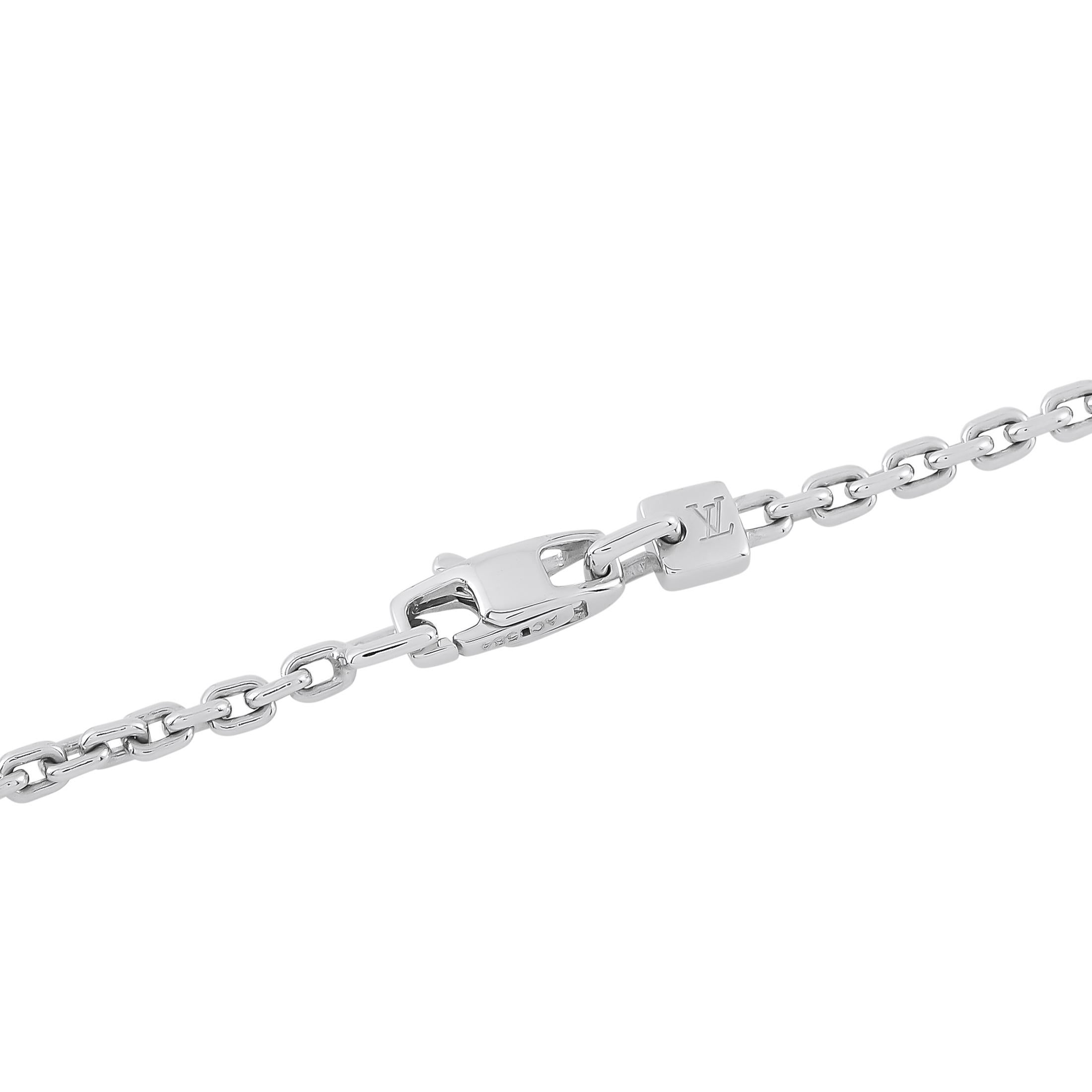 This Louis Vuitton necklace beautifully showcases the luxury brand's instantly recognizable logo. Crafted from 18K White Gold, it shines to life thanks to inset Diamond accents with a total weight of 1.30 carats. The Large pendant measures 1.50 long