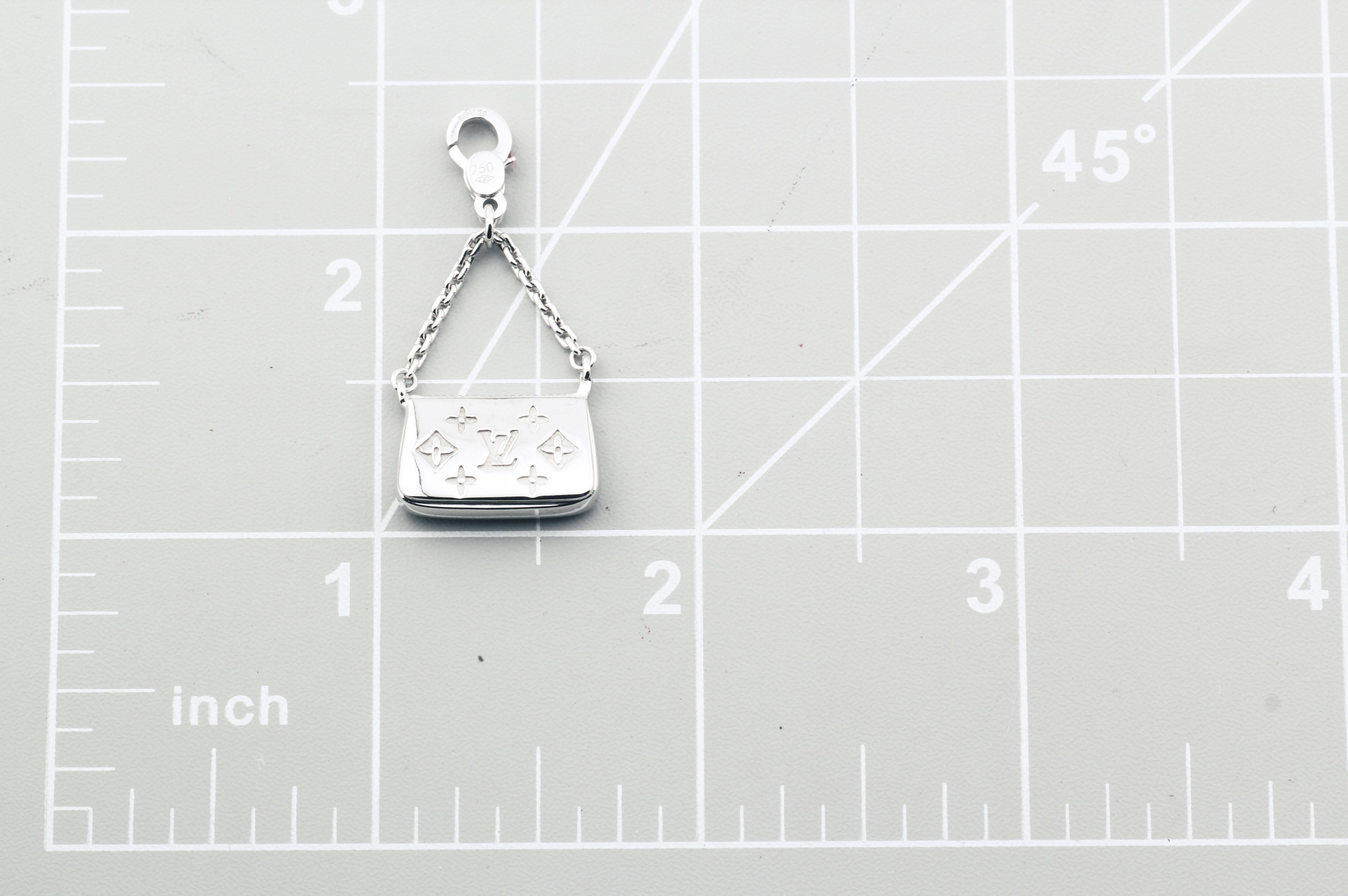 The Louis Vuitton 18K White Gold Purse Charm Pendant is a delightful and luxurious accessory that embodies the fashion-forward spirit of Louis Vuitton. Crafted from 18k white gold, this charm pendant is designed in the shape of a miniature purse,