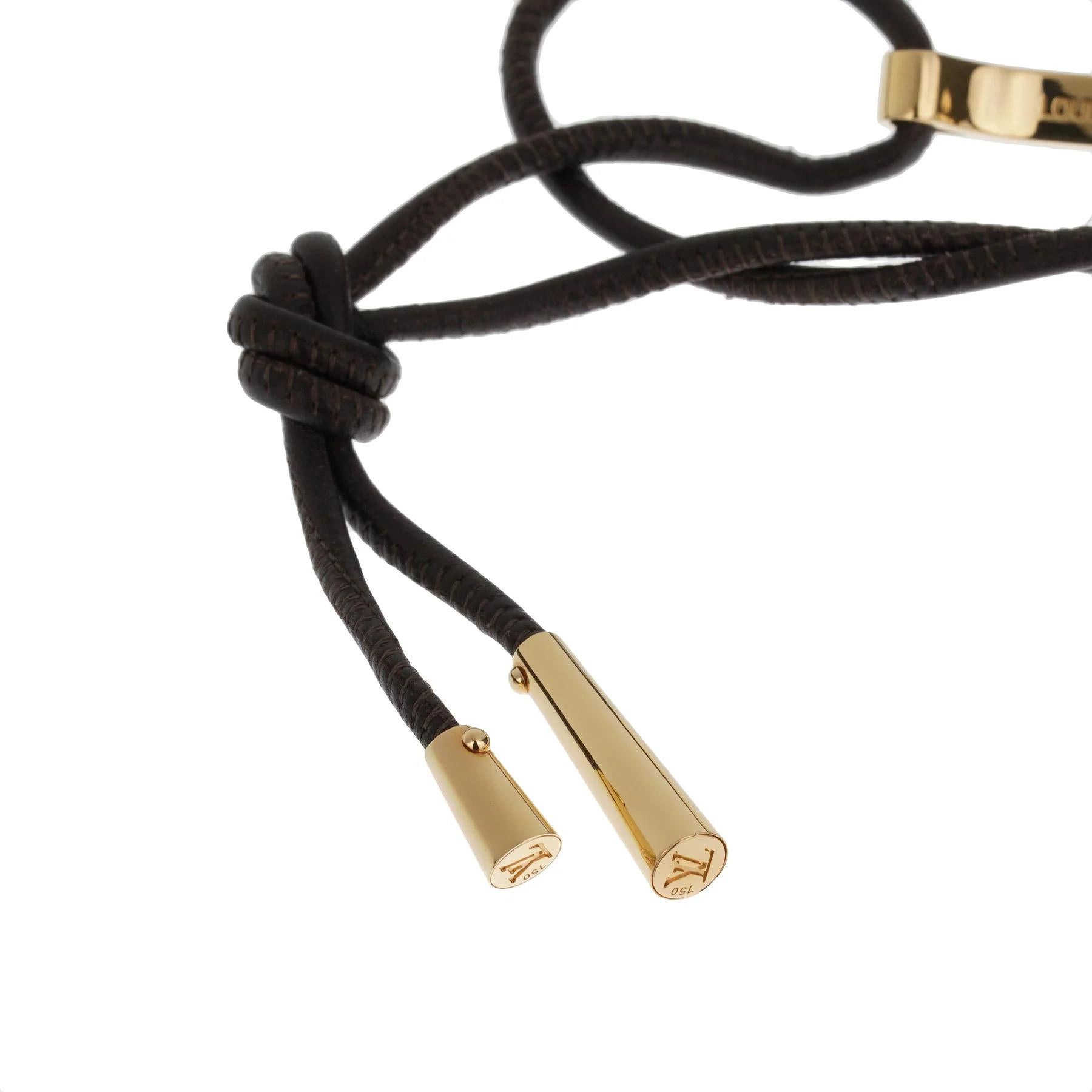 The Louis Vuitton Yellow Gold Bangle Leather Bracelet is a striking fusion of modern sophistication and timeless craftsmanship, exemplifying the maison's dedication to luxury and innovation. This exquisite piece blends the warmth and elegance of 18k