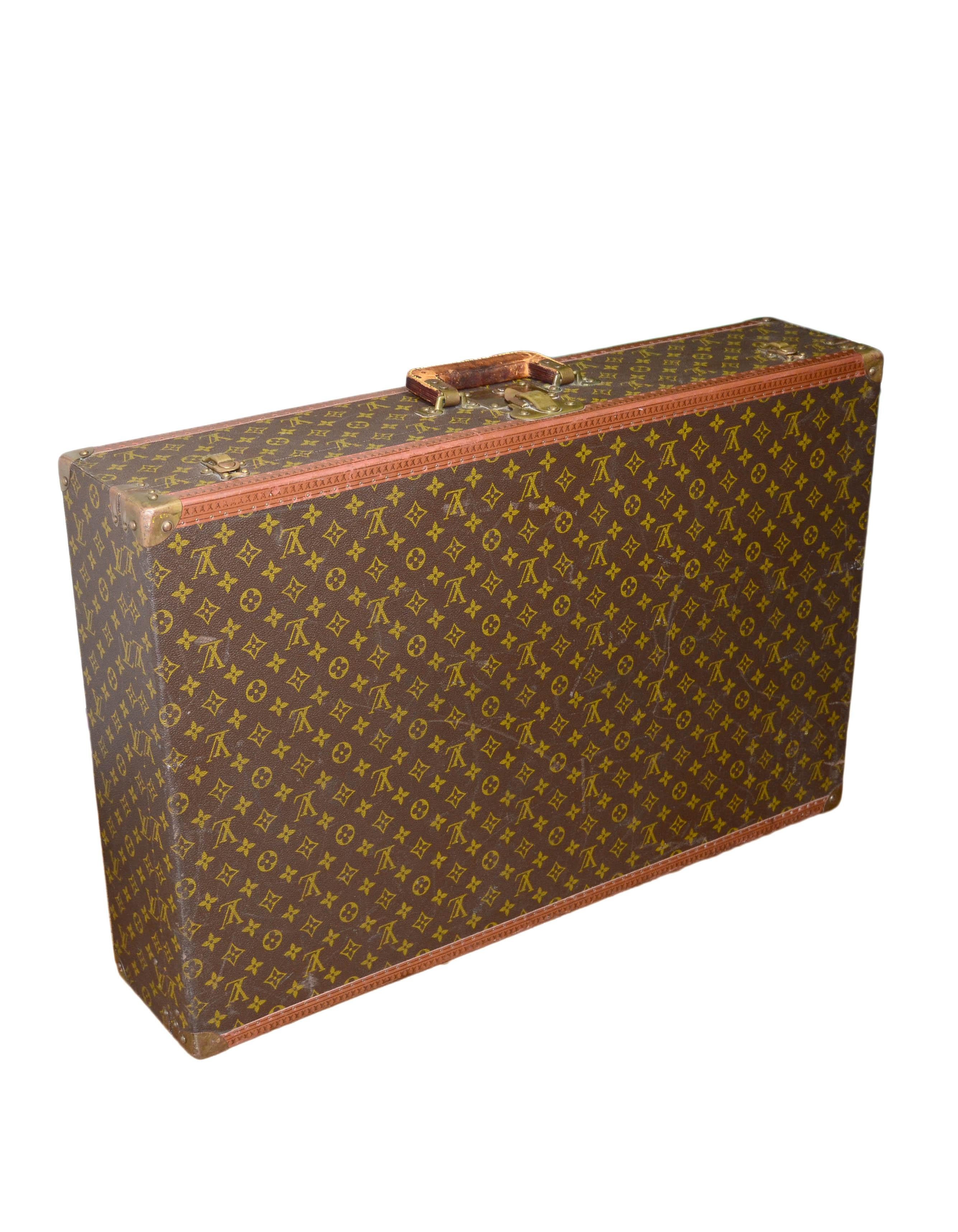 Louis Vuitton Vintage Monogram Hardcase Bisten 80

Made In: France
Year of Production: Circa 1960s/1970s
Color: Brown
Hardware:Brass
Materials: Monogram coated canvas with leather trim and golden brass corners
Lining: Beige canvas
Closure/Opening: