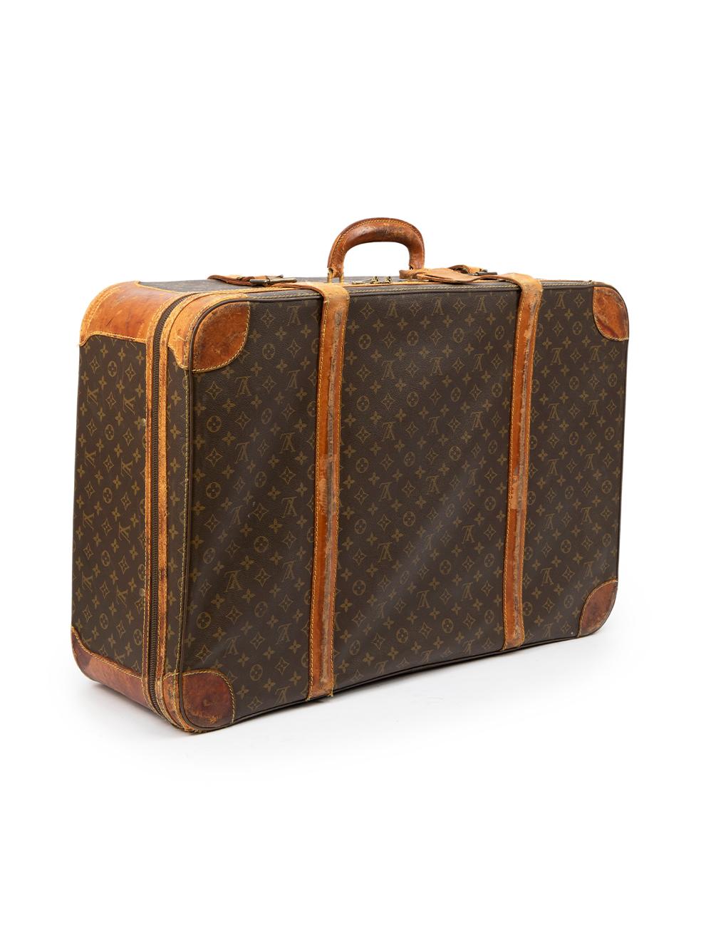 CONDITION is Good. General wear to suitcase is evident. Moderate signs of wear seen throughout to the leather at the sides, front and back with discoloured marks, abrasions and scratches, as well as one strap having broken. One zip pull is missing,