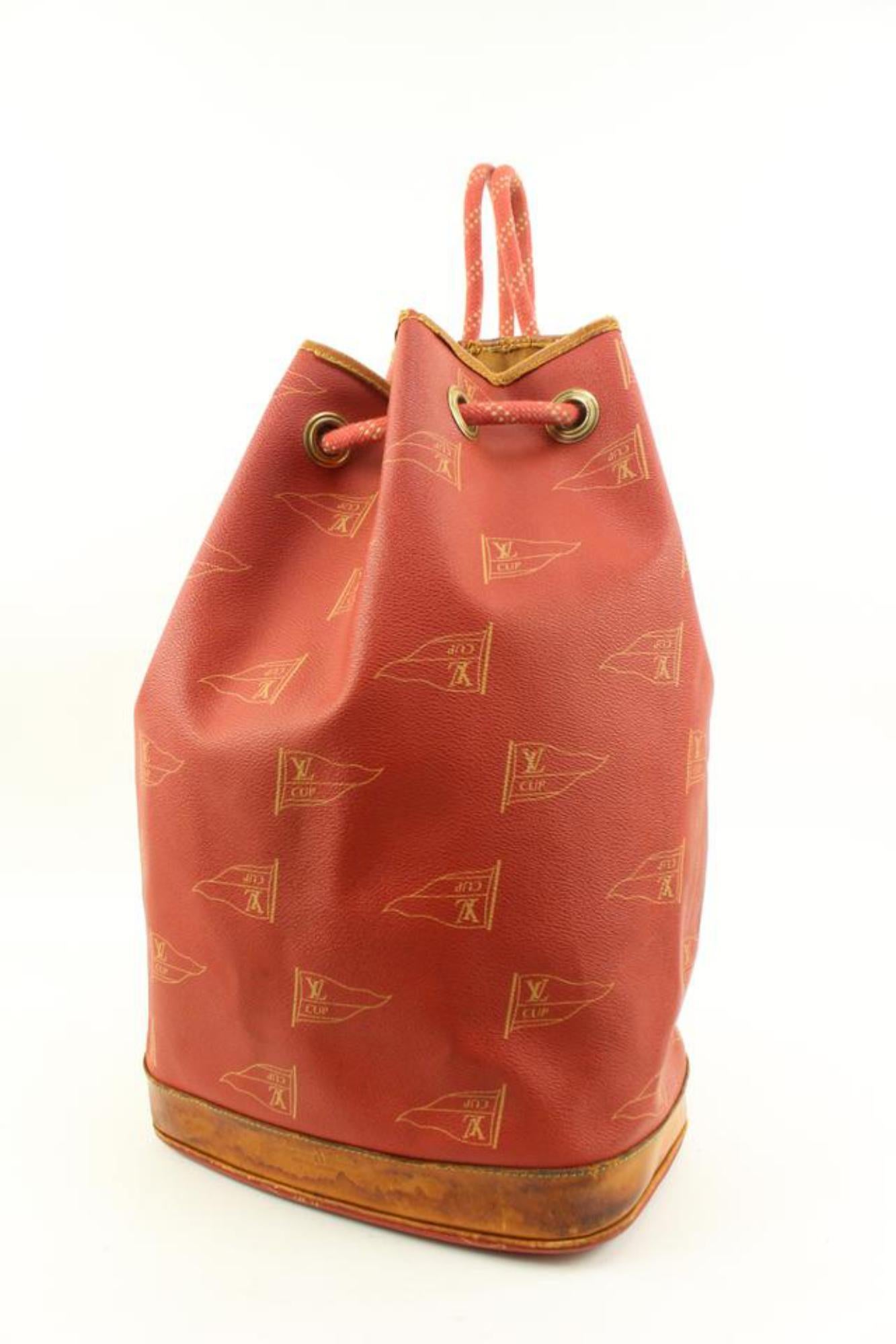 Louis Vuitton 1995 LV Cup Red St Tropez Drawstring Bucket Hobo 97lv228s
Date Code/Serial Number: SP0974
Made In: France
Measurements: Length:  15.5