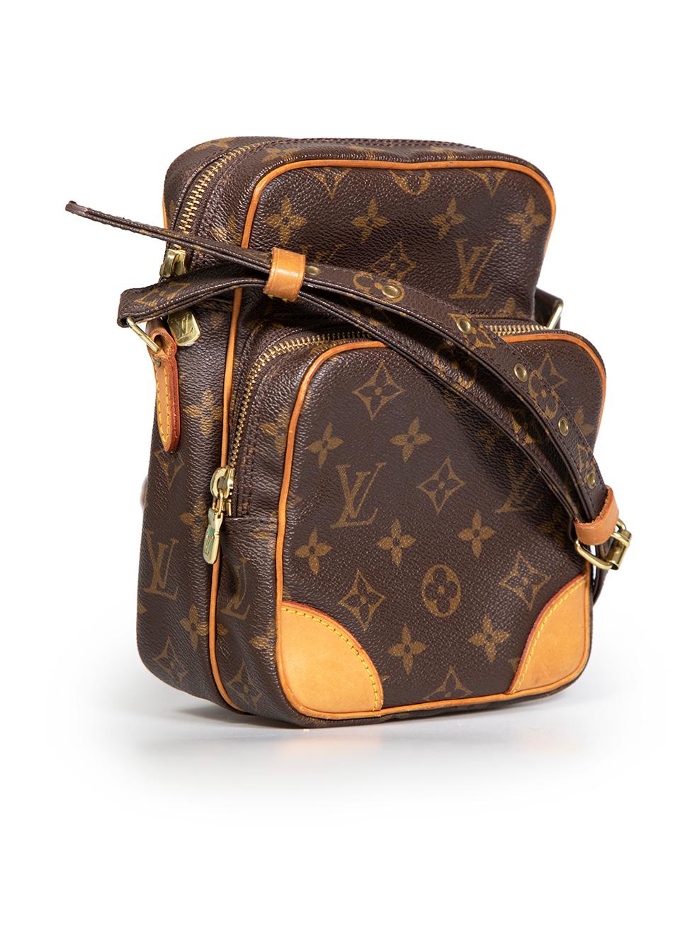 CONDITION is Good. Minor wear to bag is evident. Light wear to front, base, back, and leather trims with abrasions to the canvas and scratches to the metal hardware and cracking on the internal pocket on this used Louis Vuitton designer resale