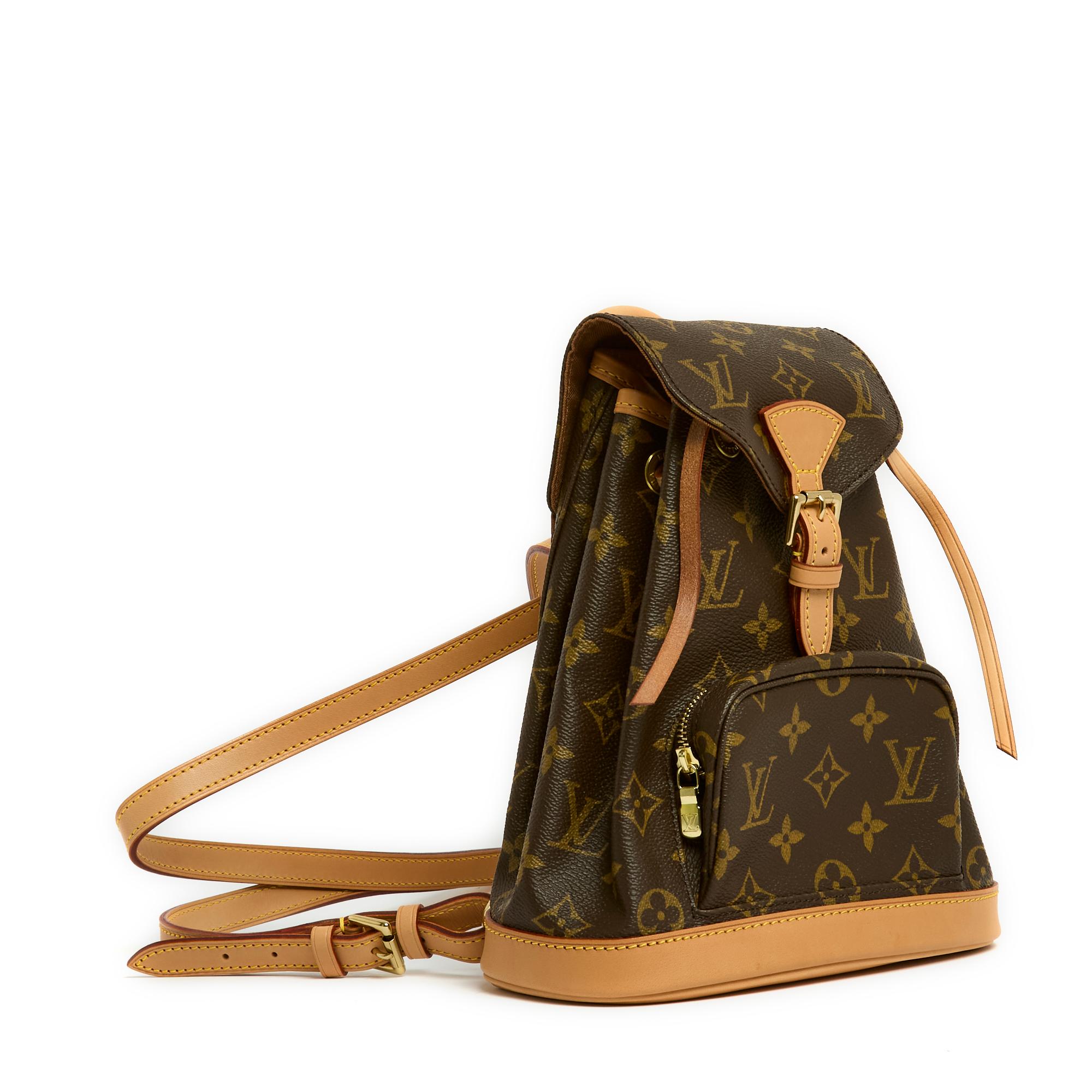 Louis Vuitton backpack, Montsouris model, Mini format, year 2001, in monogram canvas and natural leather, interior compartment lined with canvas, closed with a natural leather drawstring and a flap closed with a pin buckle, small front pocket closed