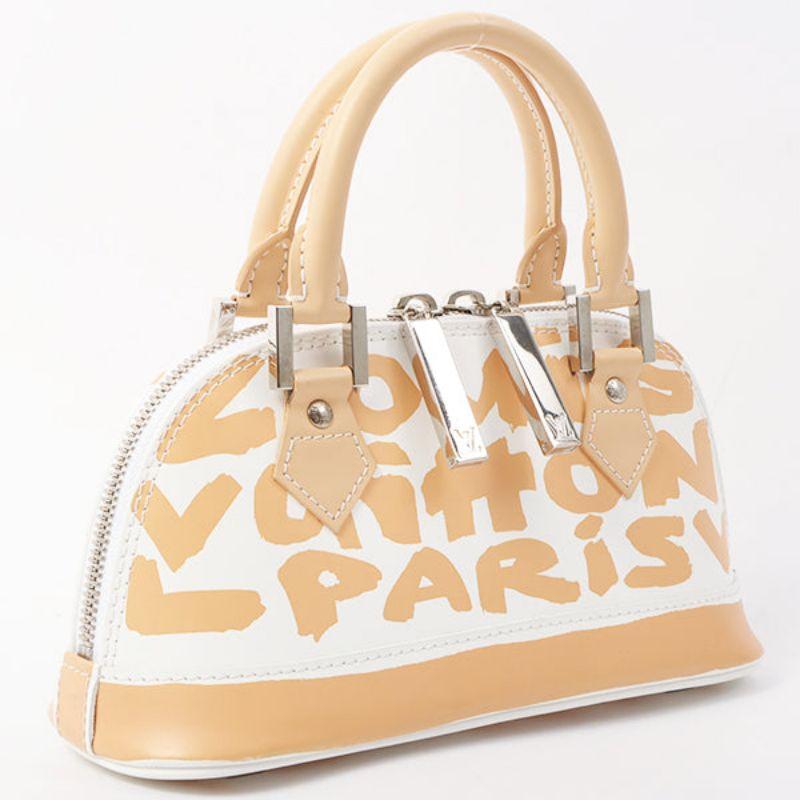 Louis Vuitton 2001 Made Graffiti Alma Pm White/Beige

Additional information:
Interior pocket x1
Year: 2001
Made in France
Measurements: 25 W x 9 D x 12 H cm
Handle: 28 cm 
Condition: Good
Front: With slight scratch and dirt
Back: With slight