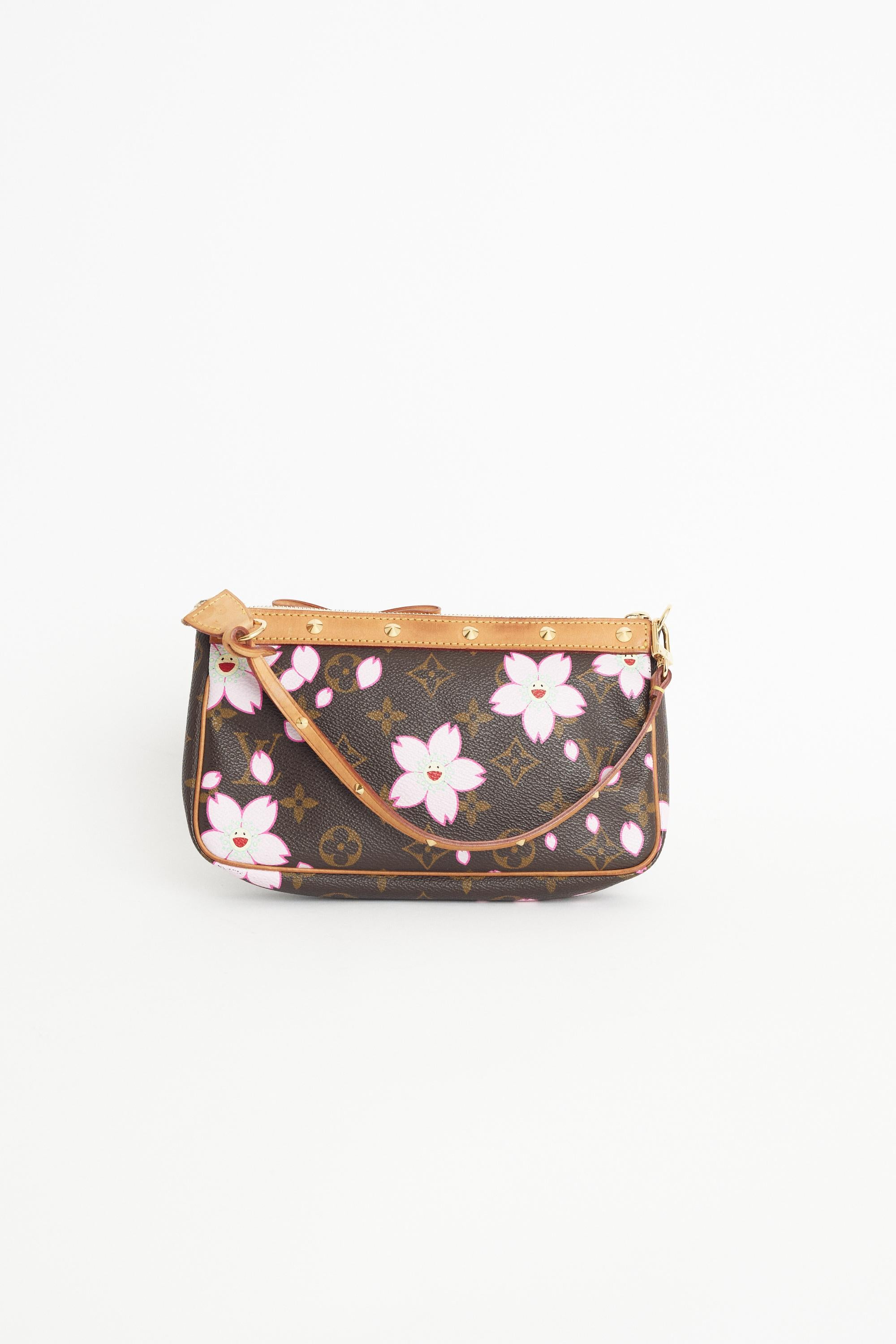 We are excited to present this Louis Vuitton x Takashi Murakami 2005 Cherry Blossom pochette bag. Features monogram print, zip closure and studded strap. Pre-loved, in excellent condition. Authenticity guaranteed.

Fabric: Leather
Dustbag: