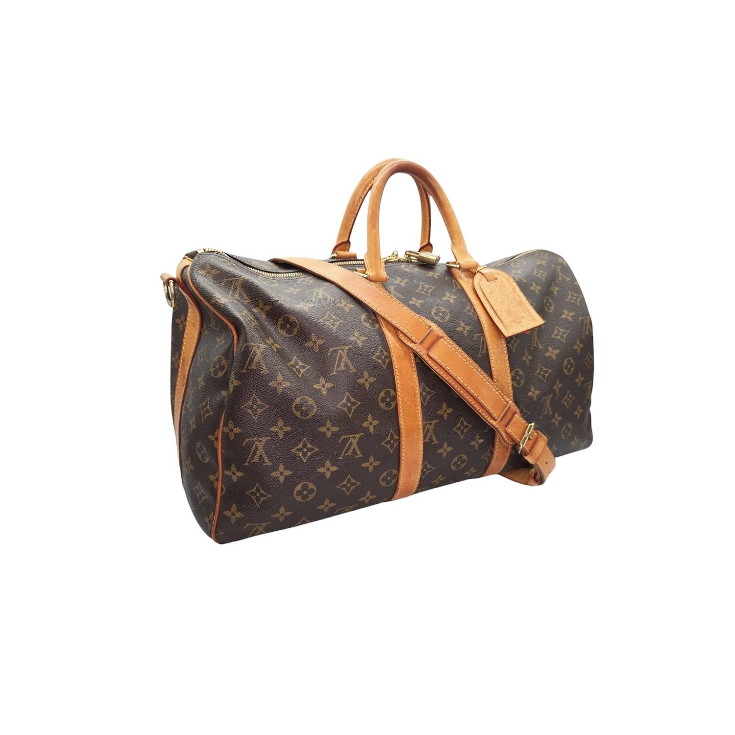 Experience luxury and sophistication with the Louis Vuitton Monogram Canvas Keepall 45. Crafted from durable monogram coated canvas and vachetta leather, it features a removable strap for versatile carrying options. The top zippers open to a