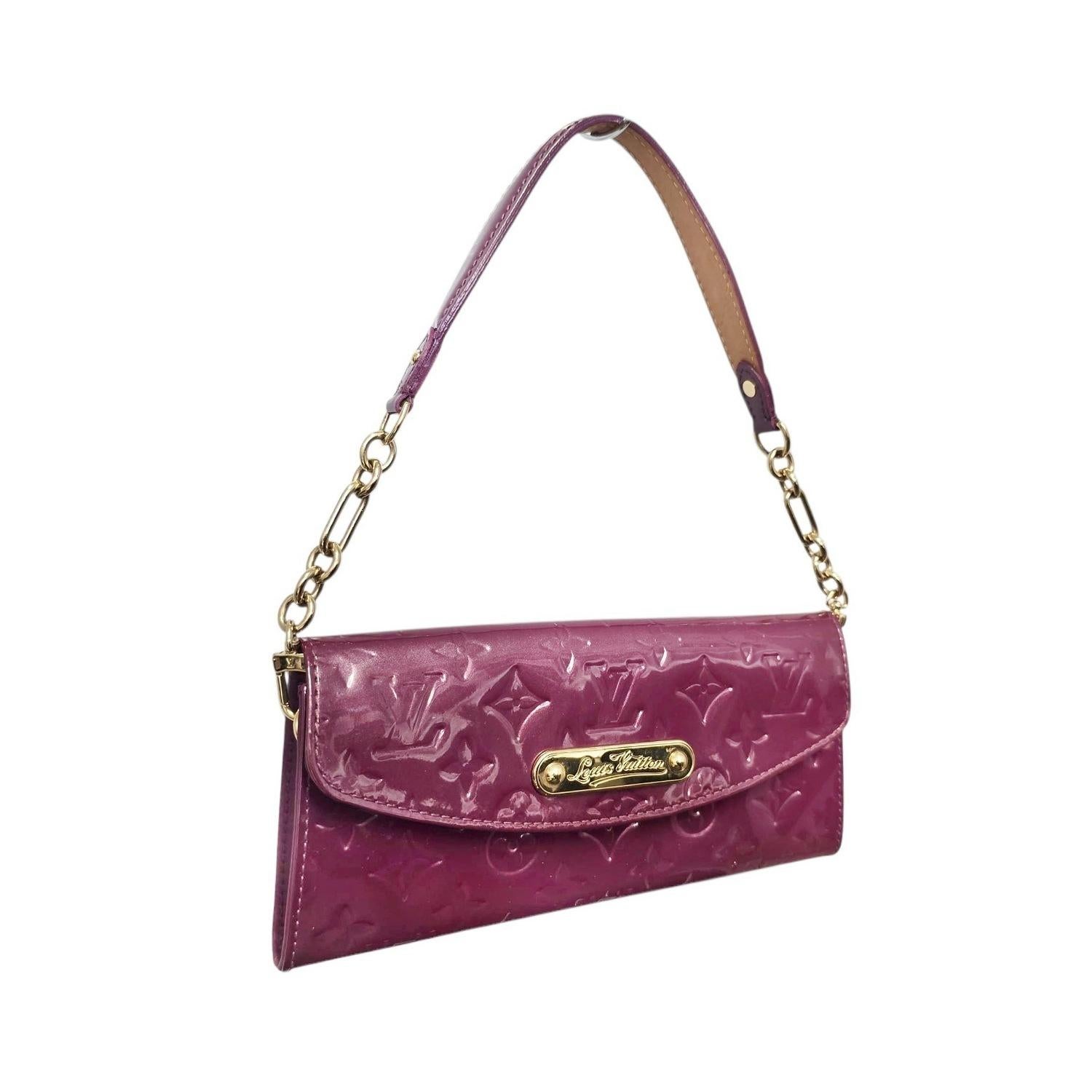 The Louis Vuitton Vernis Sunset Boulevard Handbag brings refined luxury in a rich burgundy patent leather embossed with the iconic monogram. Its front flap, accented by a gold-toned Louis Vuitton nameplate, opens to reveal a well-organized interior