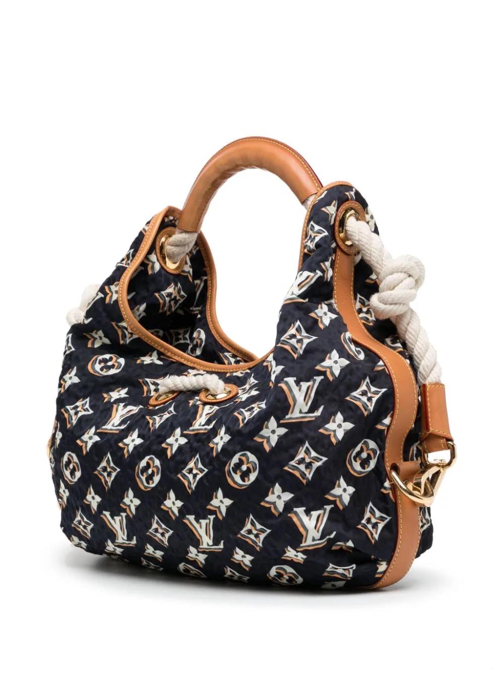 * From the 2010 cruise collection
* Navy blue/white/brown
* Leather trim
* Monogram print
* Gold-tone logo plaque
* Rope detailing
* Single rolled top handle
* Drawstring fastening
* Press-stud fastening
* Internal zip-fastening pocket
* Very Good