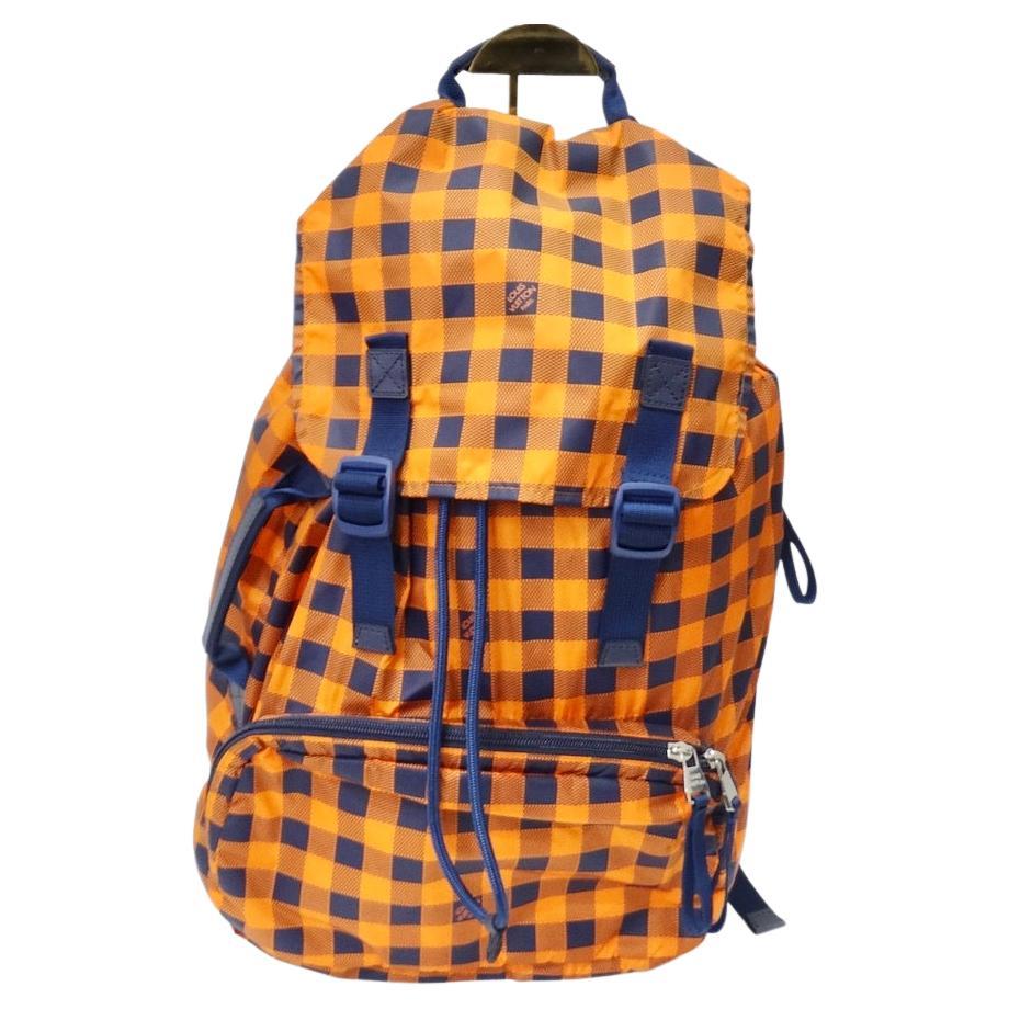 Practical and Stylish 2012 Damier Masai Adventure Practical backpack from Louis Vuitton. Louis Vuitton presents it take on the classic nylon backpack in this super fun orange and navy gingham pattern. The backpack features two adjustable shoulder